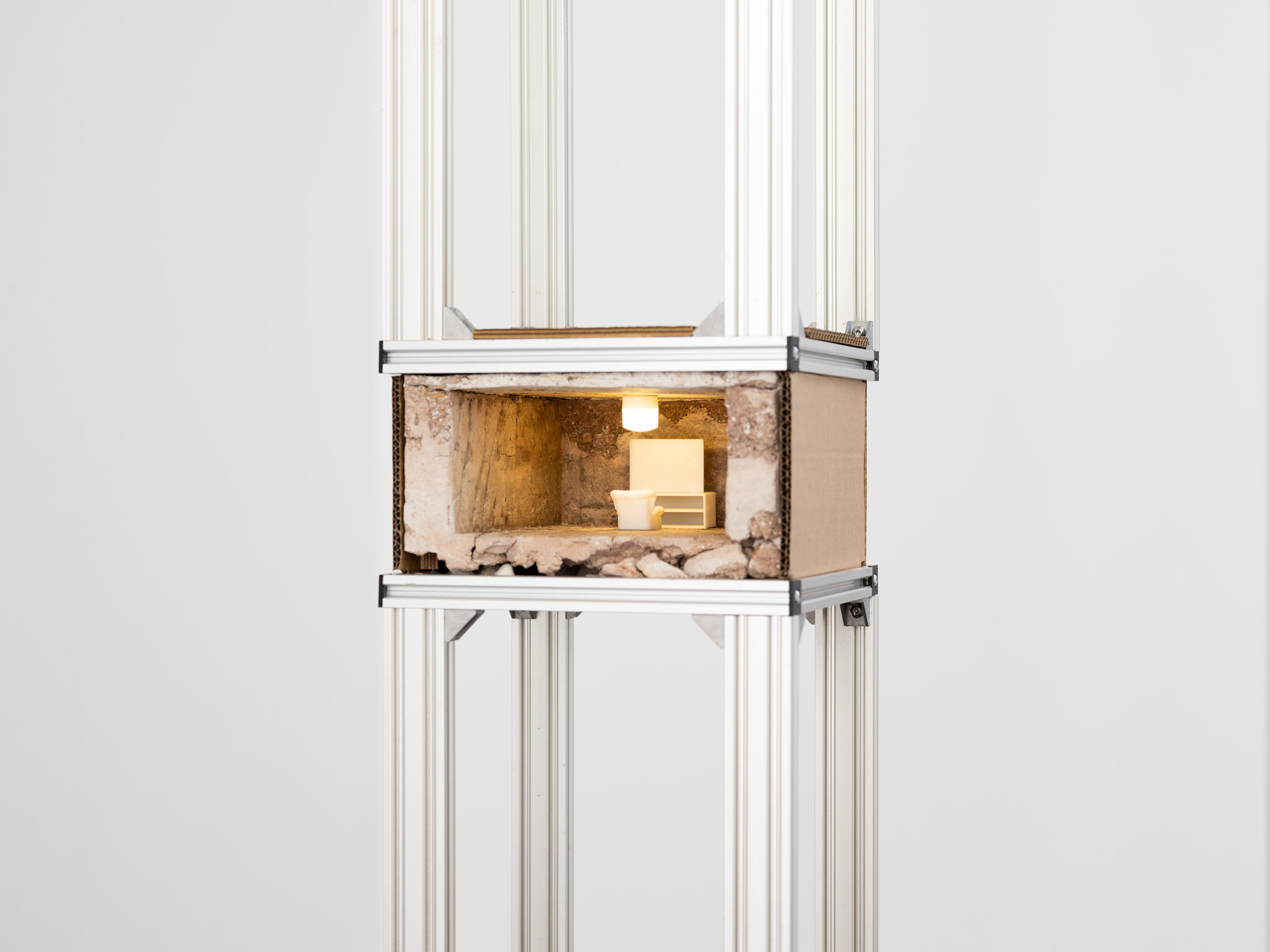 That’s the world I’m going to send you to!, 2024 3D printer, lime mortar, aluminium v slot, cardboard, 3D printed furniture, light 25 x 27 x 360cm (height variable)