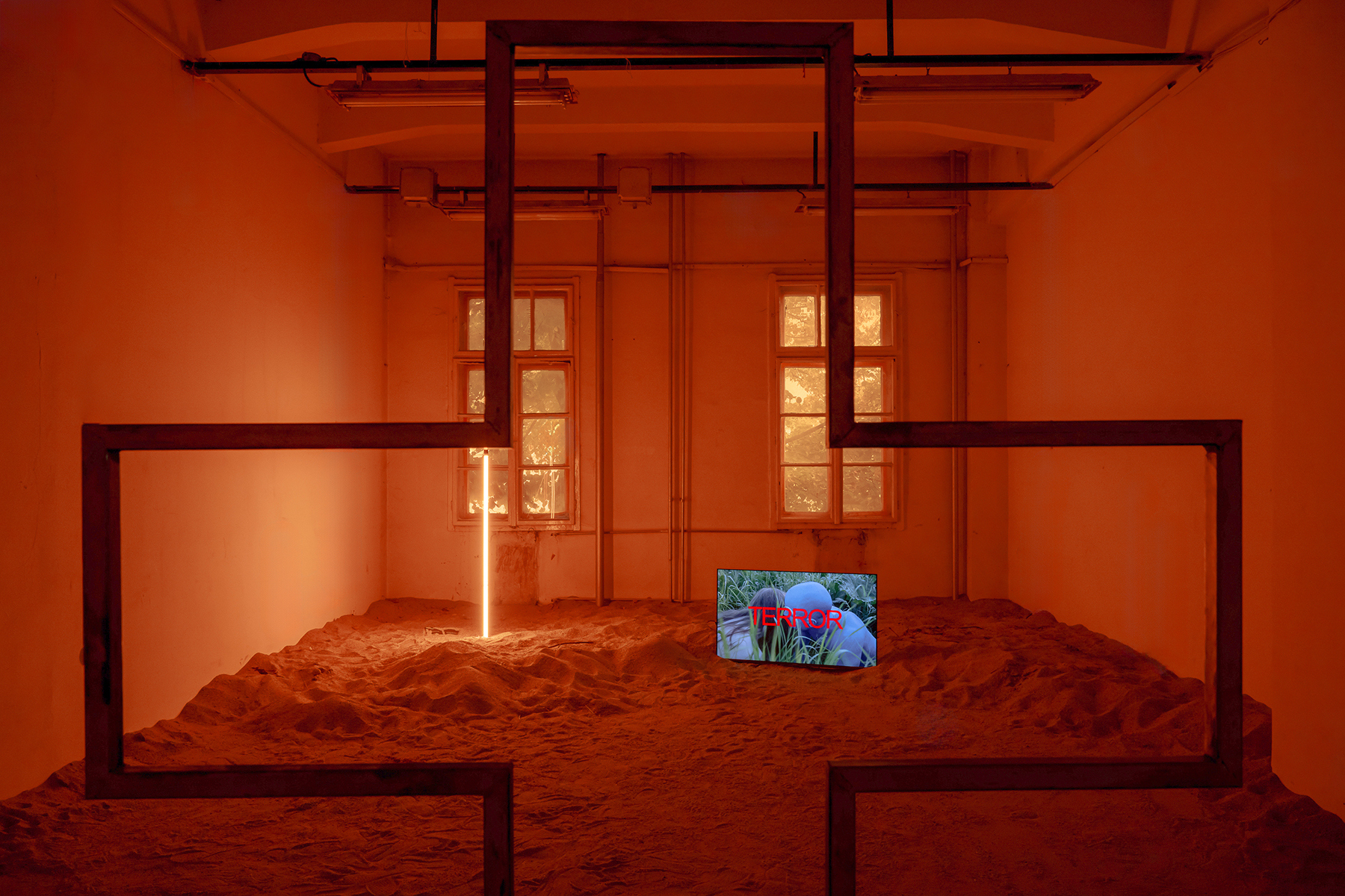 Tudor Ciurescu, DUSTULATOR, 2023 Welded steel, 184 × 80 × 41 cm and Tim Plamper, Exit II (The Beloved Dies), 2021 4K Video, 19:34 min