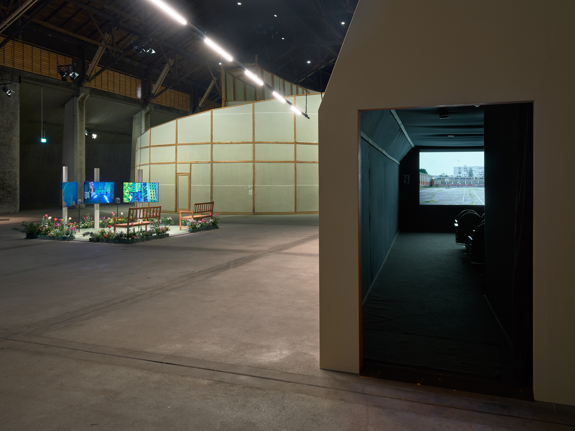 Cinema Pavillon, right; Yuri Yefanov, left; Ilya & Emilia Kabakov, behind. Cinema Pavillon; We will definitely talk about this after the last air raid alert stops (2024, left), The Palace of Projects (1998, background). Photo: Henning Rogge. Courtesy UKR