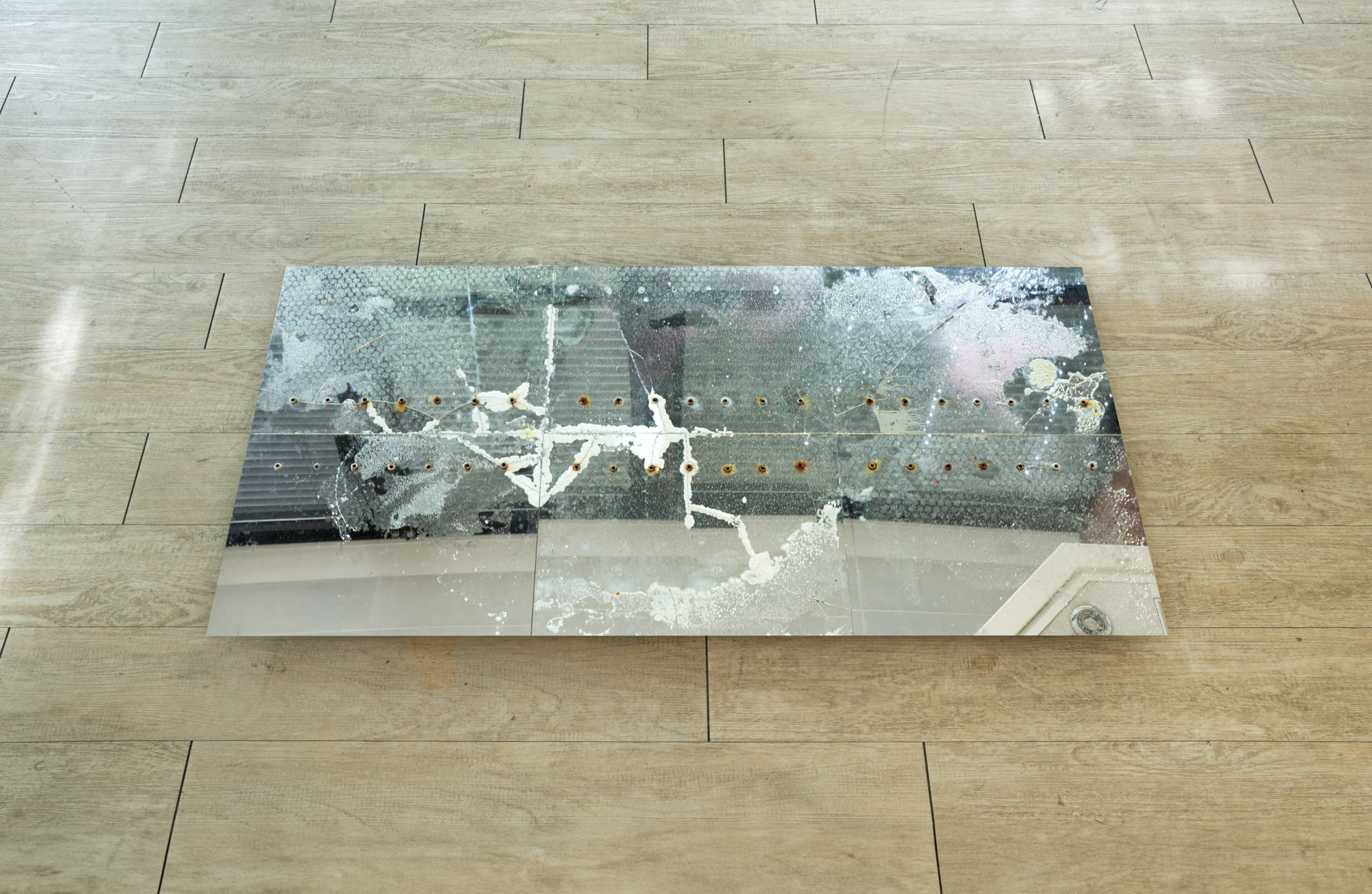 Nina Nadig, Untitled (updown_updown), 2023, Mirror, eyelets, salt, sugar, aluminium, Dimensions variable