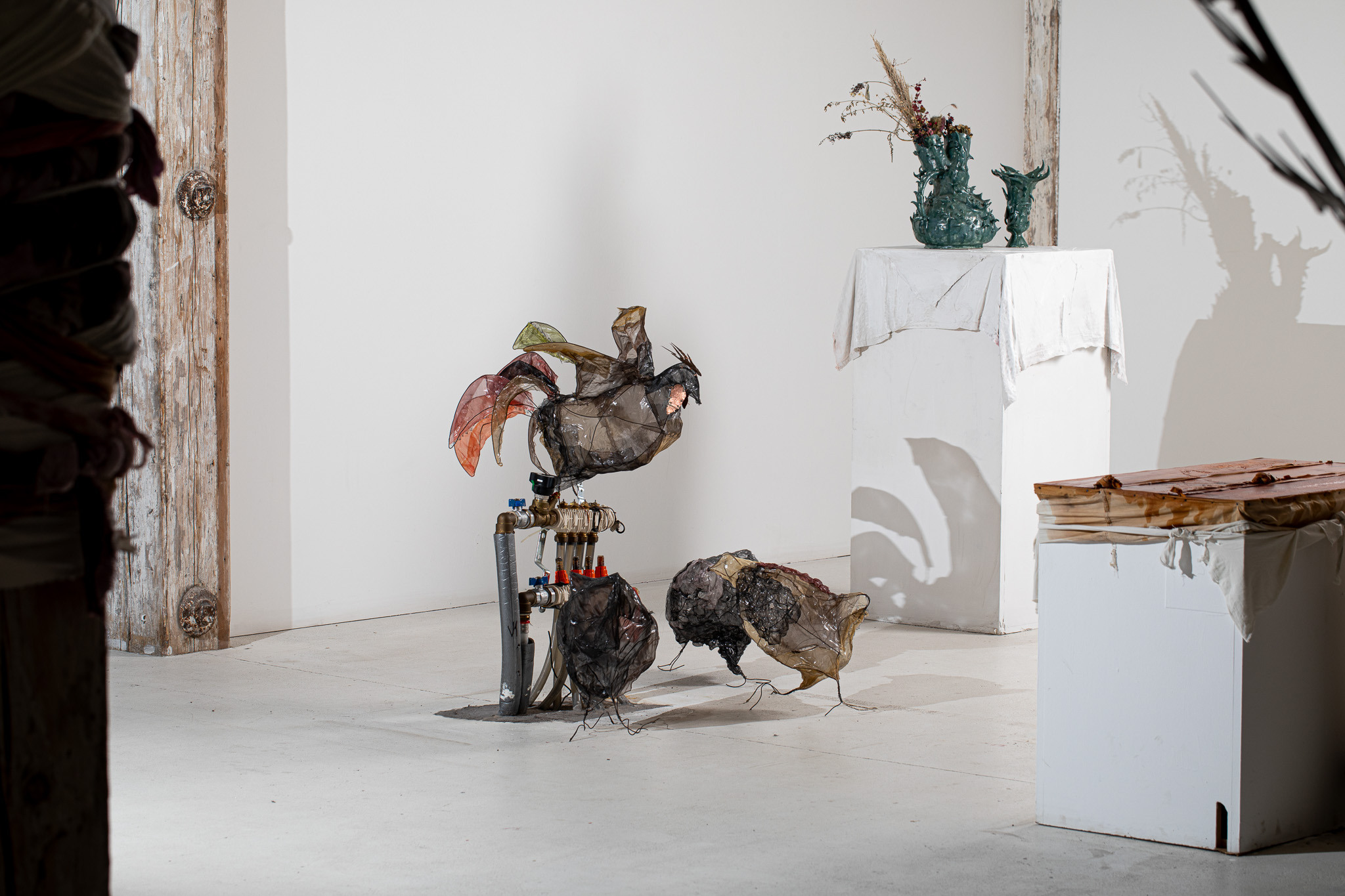 Anna Marie Berdychová & Samuel Stano, Fatty the Pawn, 2023; Timur Aloev, Vase (artifacts from Eden series), 2021; exhibition view from To the Bottom of the Goblet, Art Quarter Budapest