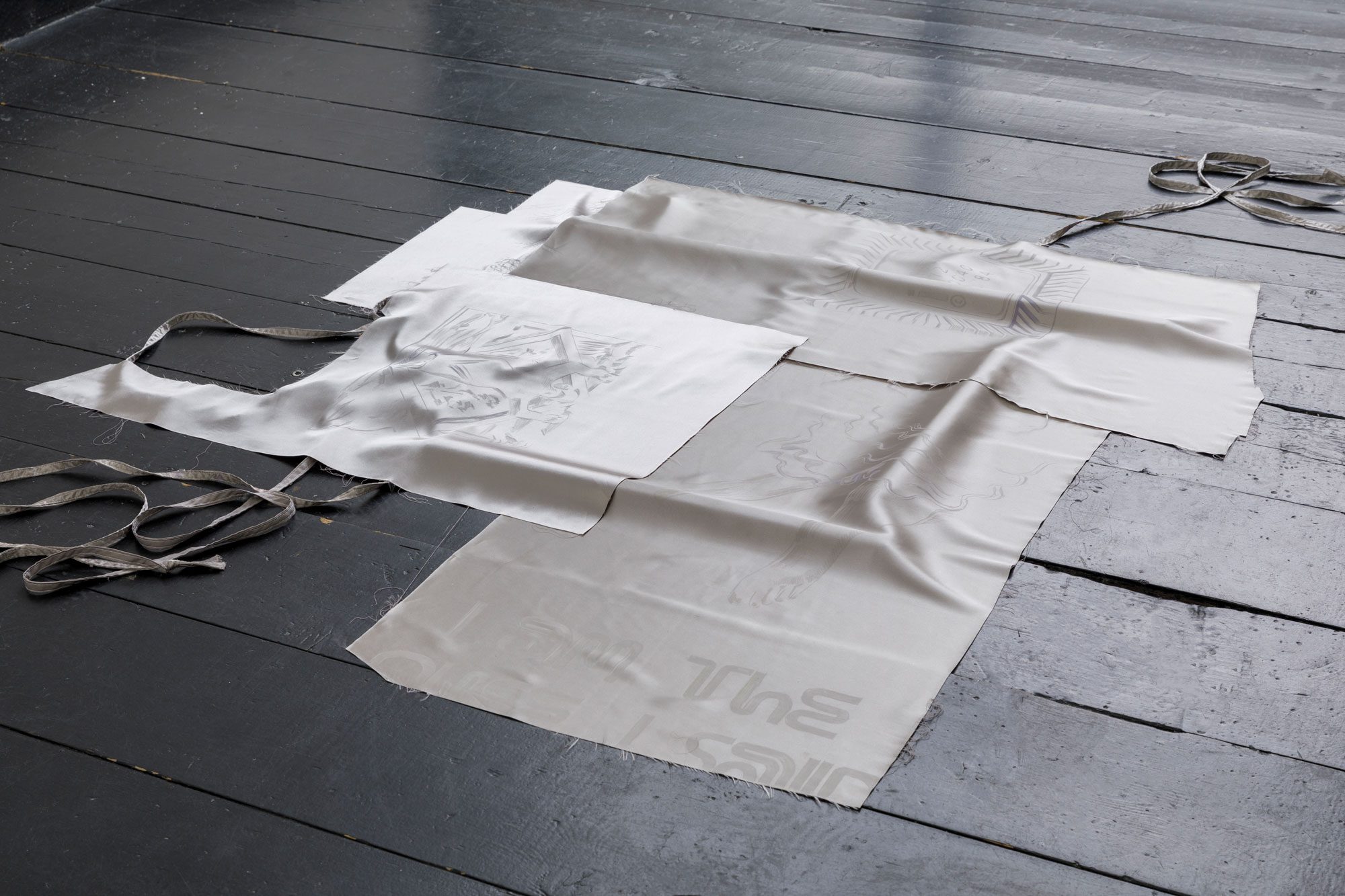 Nora Hansen, my stony skin and mettle bones, 2024, polychromos crayon on polyester satin, printed mesh, sea shells, 2024