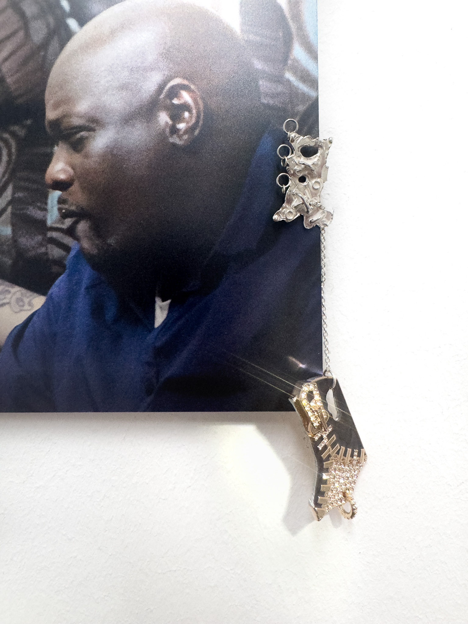 Detail – Daniel Hopp with  Hellena Hueck,  Bought With Pleasure IV, 2024, sterling silver, cubic zirconia, repurposed pendant, spring steel, cardboard, metal print, 16,8 x 30cm, Sprink Düsseldorf
