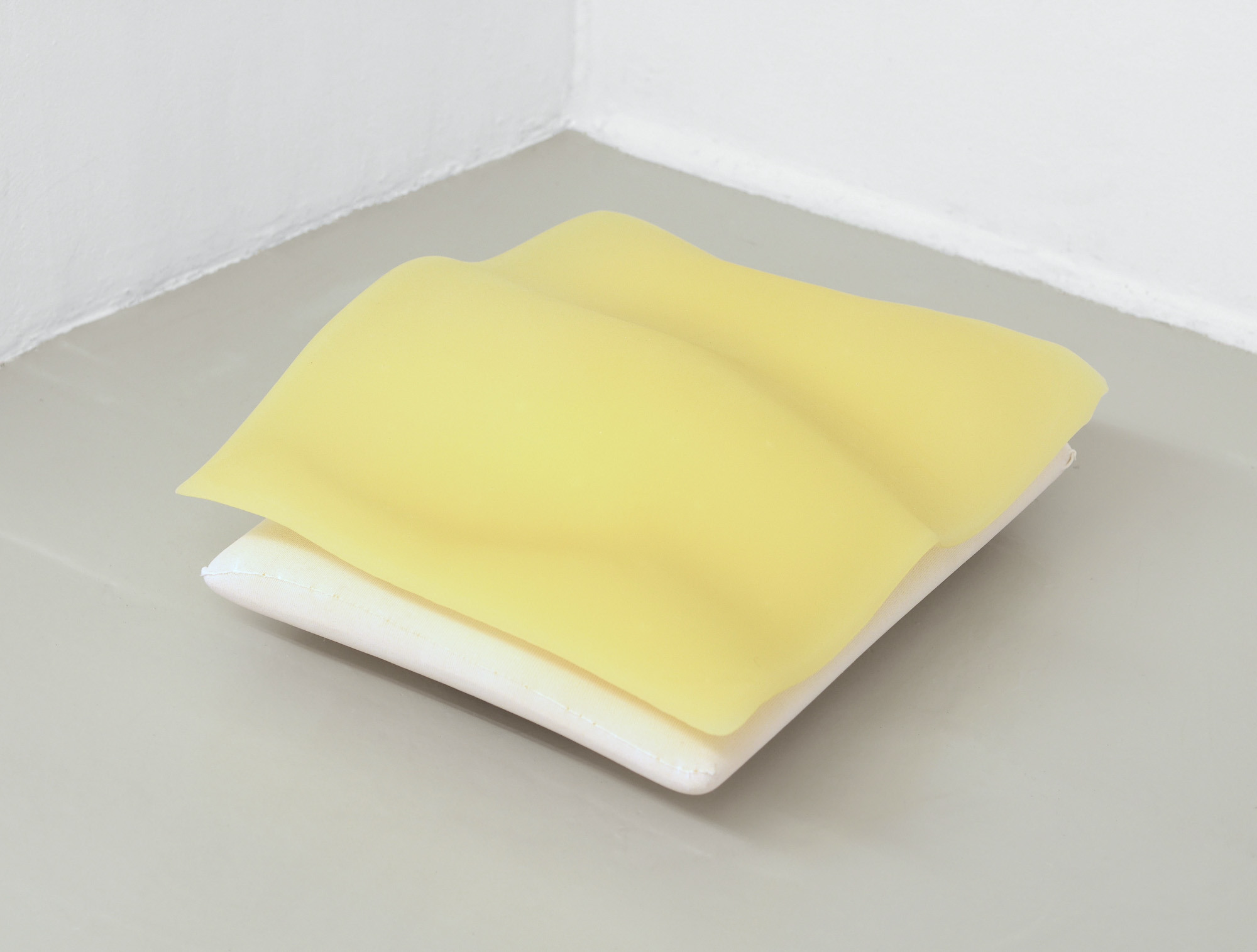 Océane Bruel, As I things need to sink, memory foam pillow, melted candles (paraffin), 2024. Photo: dylan ray arnold
