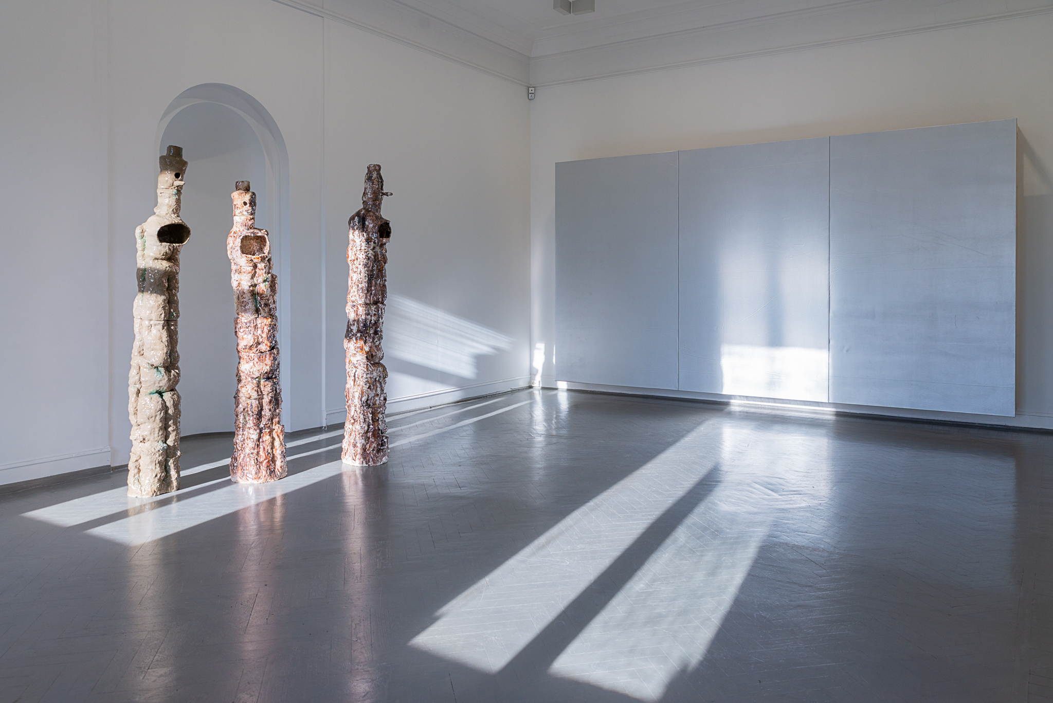 Installation view (the hall) of Floor pots (with chiminea and birdhouse) (#1, #2, #3), (2024) Glazed stoneware, Courtesy of the artist and Norwegian Sculptors Society