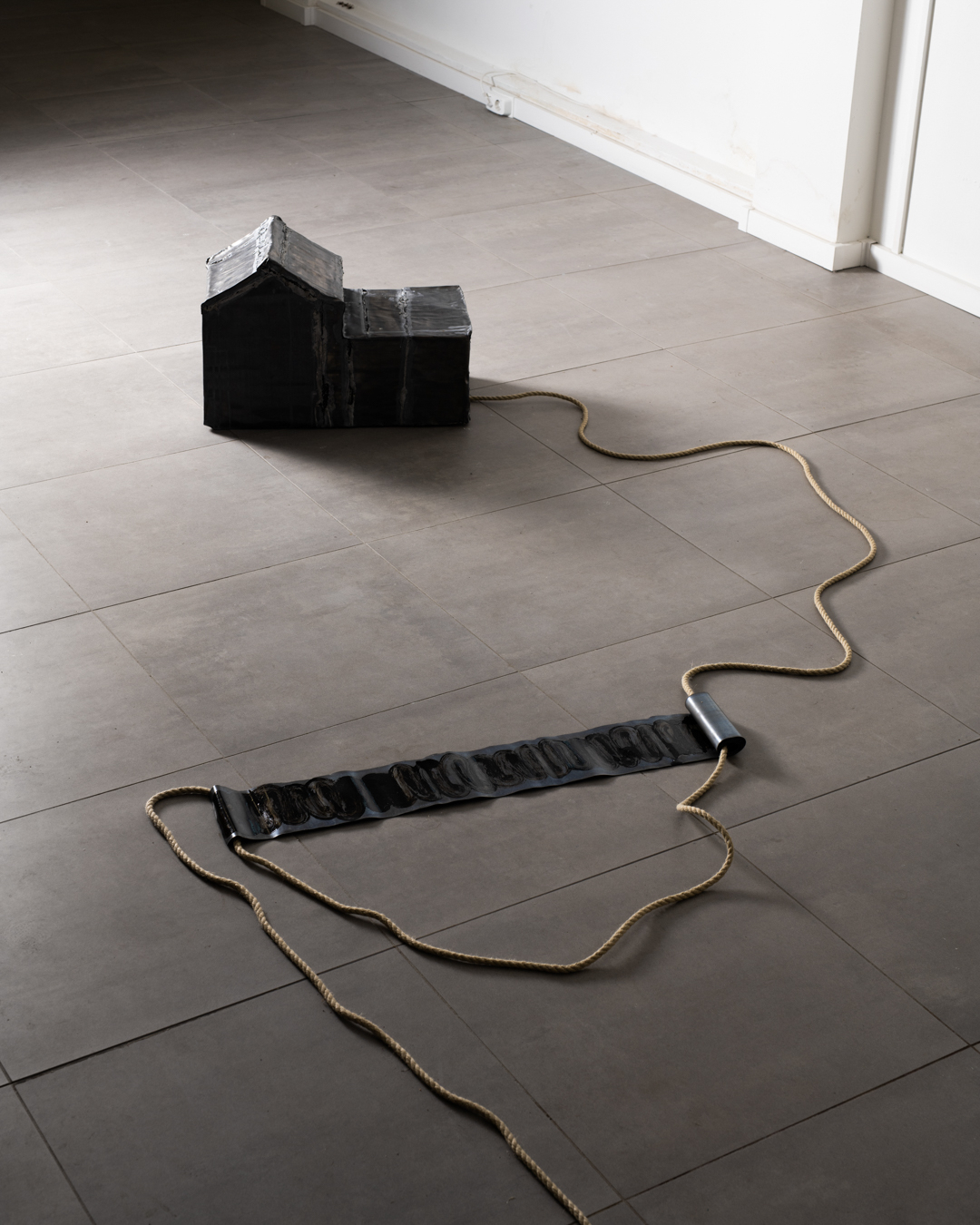 Mounir Eddib, untitled, 2024. Lead, tar, rope