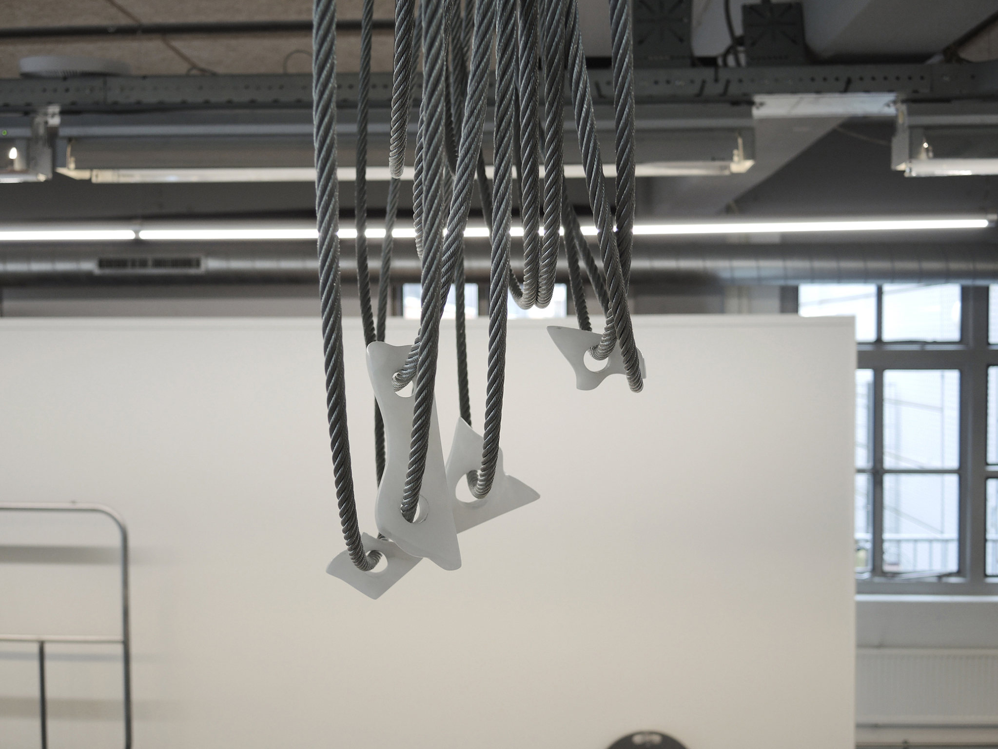 Sibylle Eimermacher, âNestingâ, steel cable, alabaster, tie wraps, 2024
