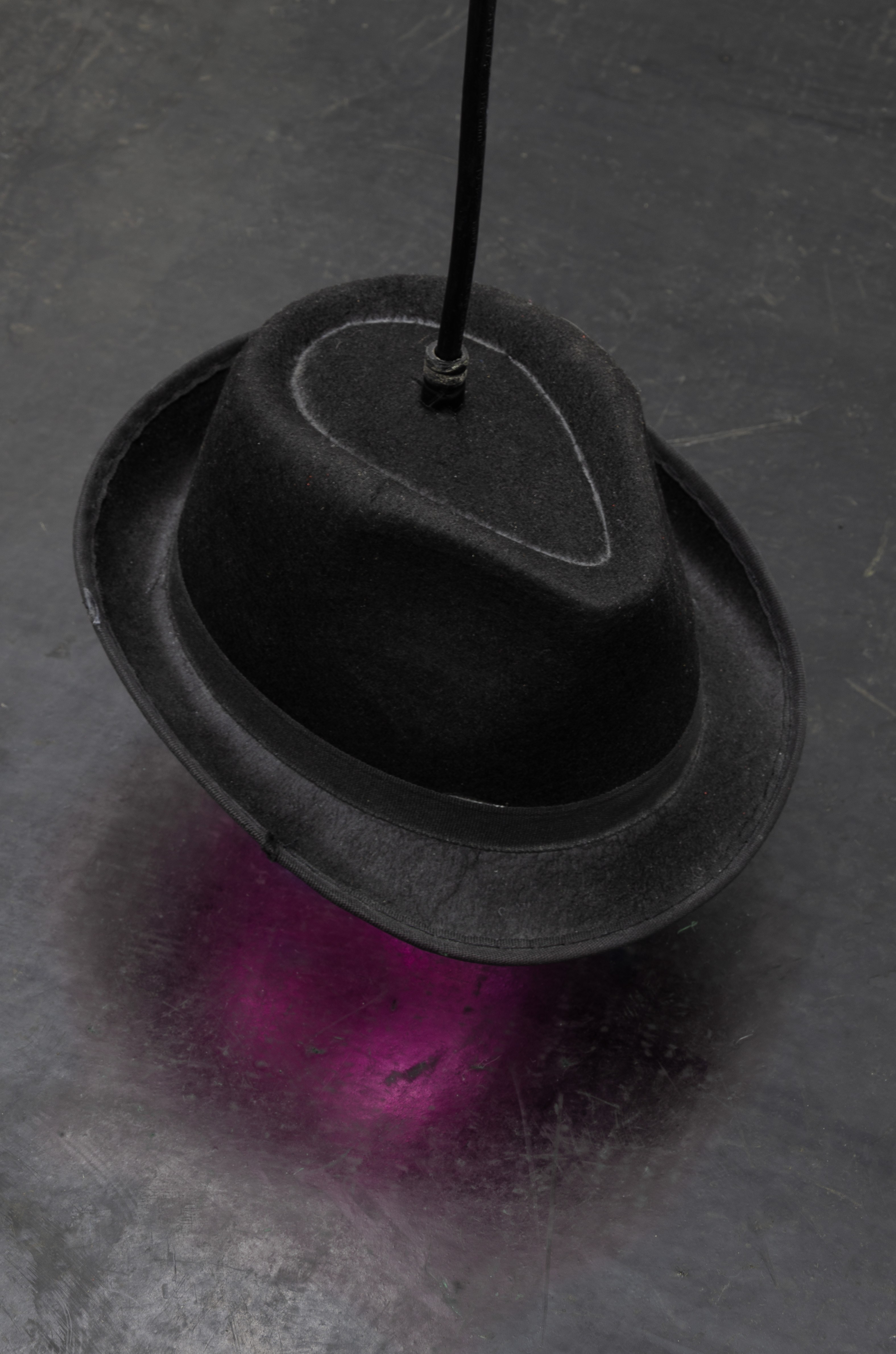 Connor Crawford, Flughafenhut, 2024, Hat, power cable, RGB led strip, MP3 player, speaker, electronics, mp3 playlist (9 files, runtime 28min 20sec), Dimensions variable