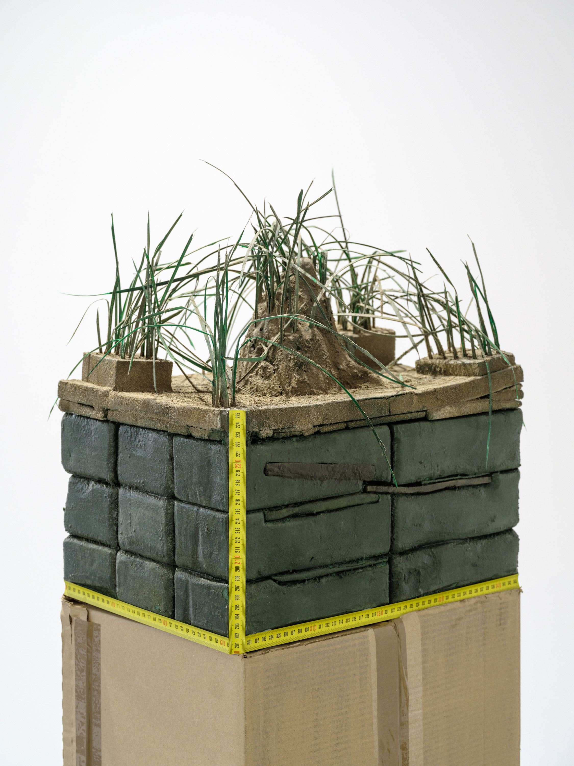 Piotr Kowalski "Soil cross-section", 2024, flower foam, plastic, clay, measuring tape, 50 x 45 x 32 cm