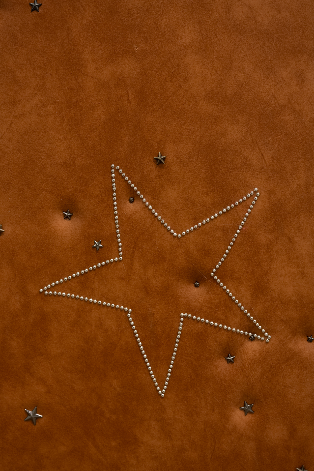 Cindy Hill, "Permissions" (detail), salvaged leather doors, leather star studs, 45â x 31â x 80â, 2024