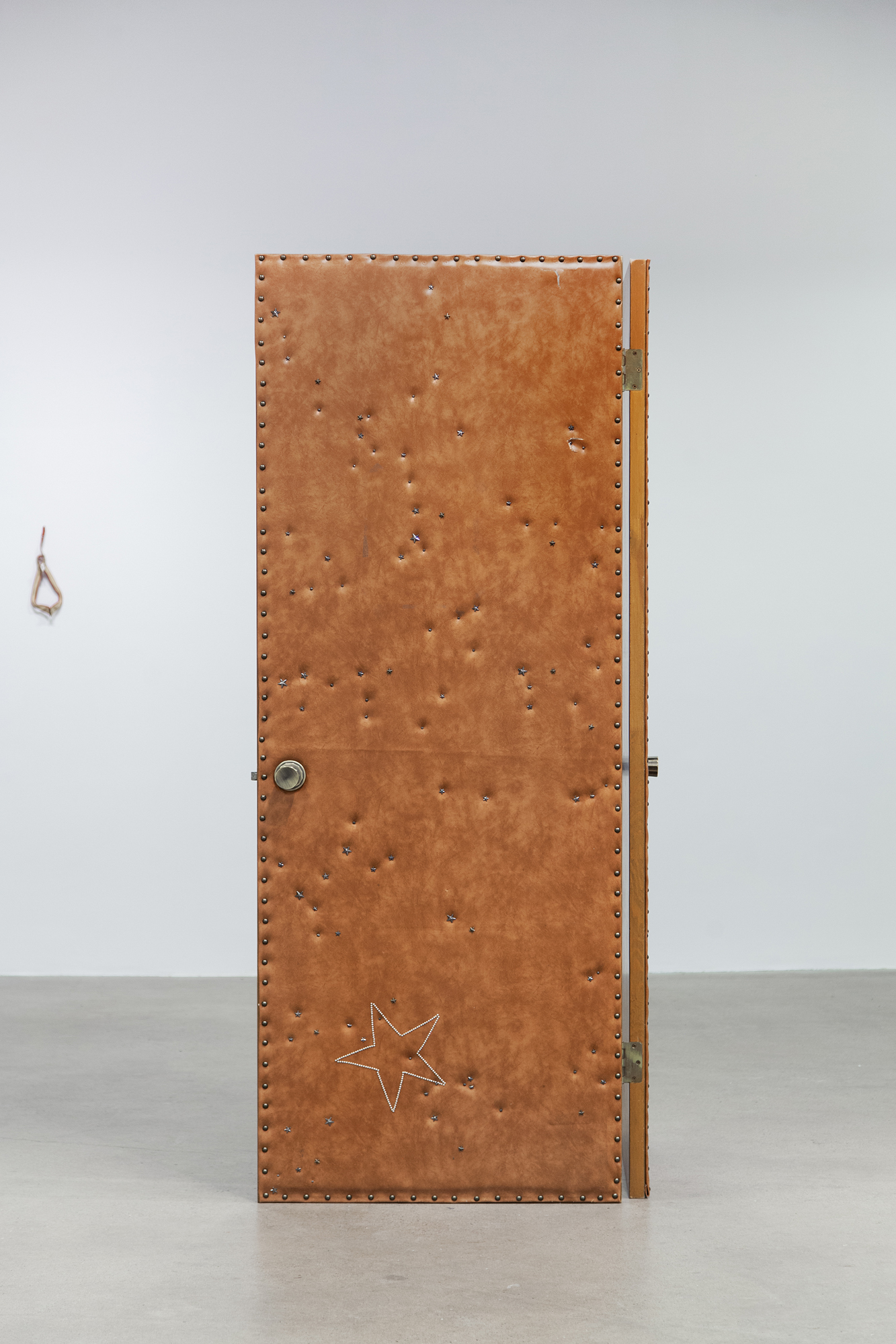 Cindy Hill, "Permissions", salvaged leather doors, leather star studs, 45â x 31â x 80â, 2024