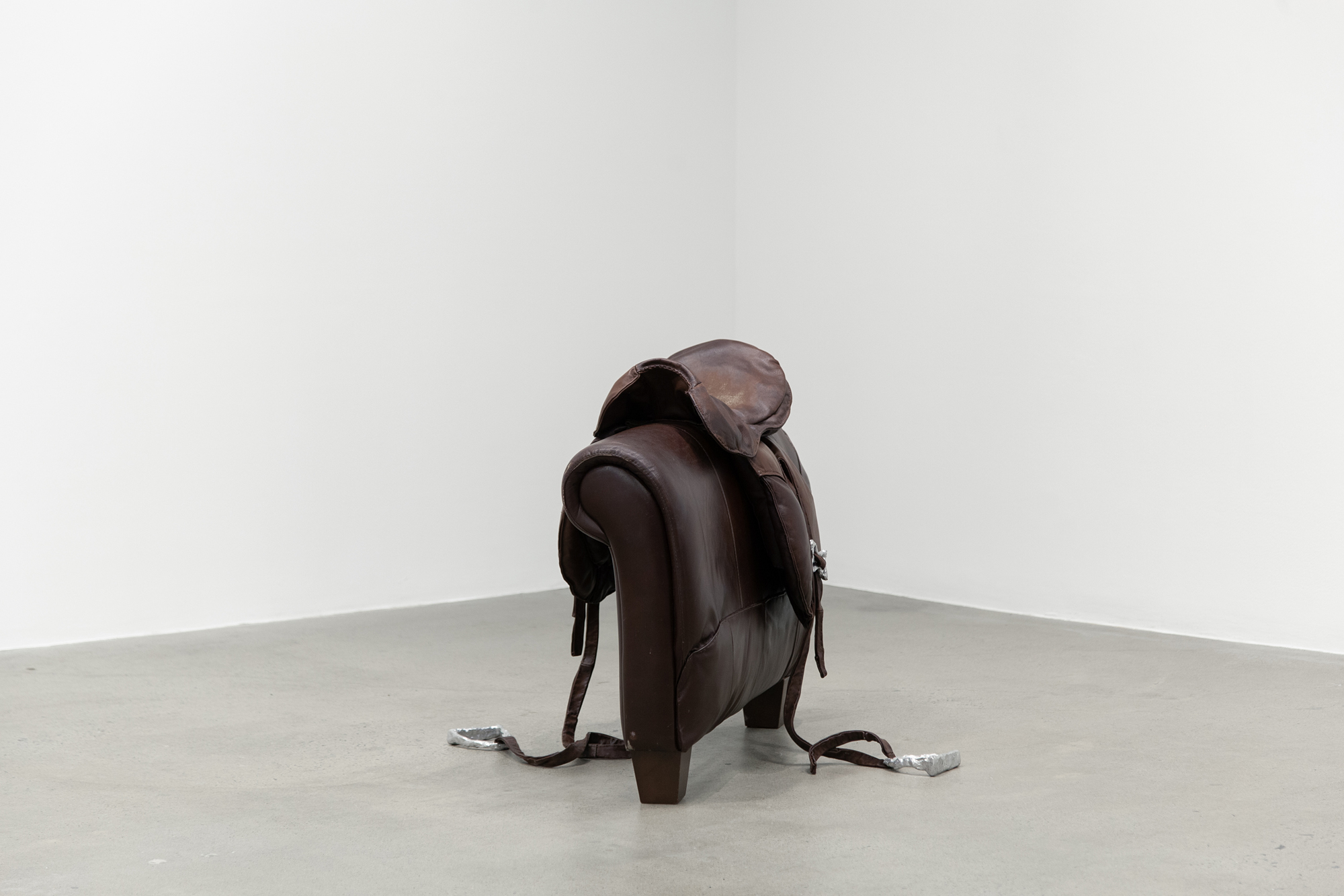 Cindy Hill, "Bridle Fantasy", used leather couch, deconstructed and hand-sewn back together, cast aluminum, 38â x 50â x 30â, 2023