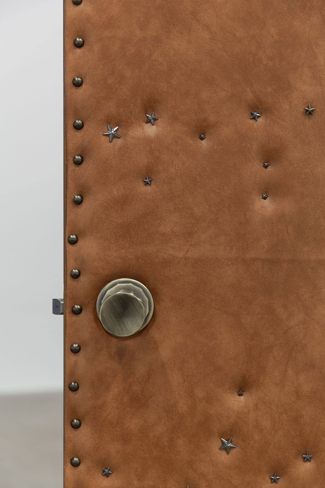 Cindy Hill, "Permissions" (detail), salvaged leather doors, leather star studs, 45â x 31â x 80â, 2024