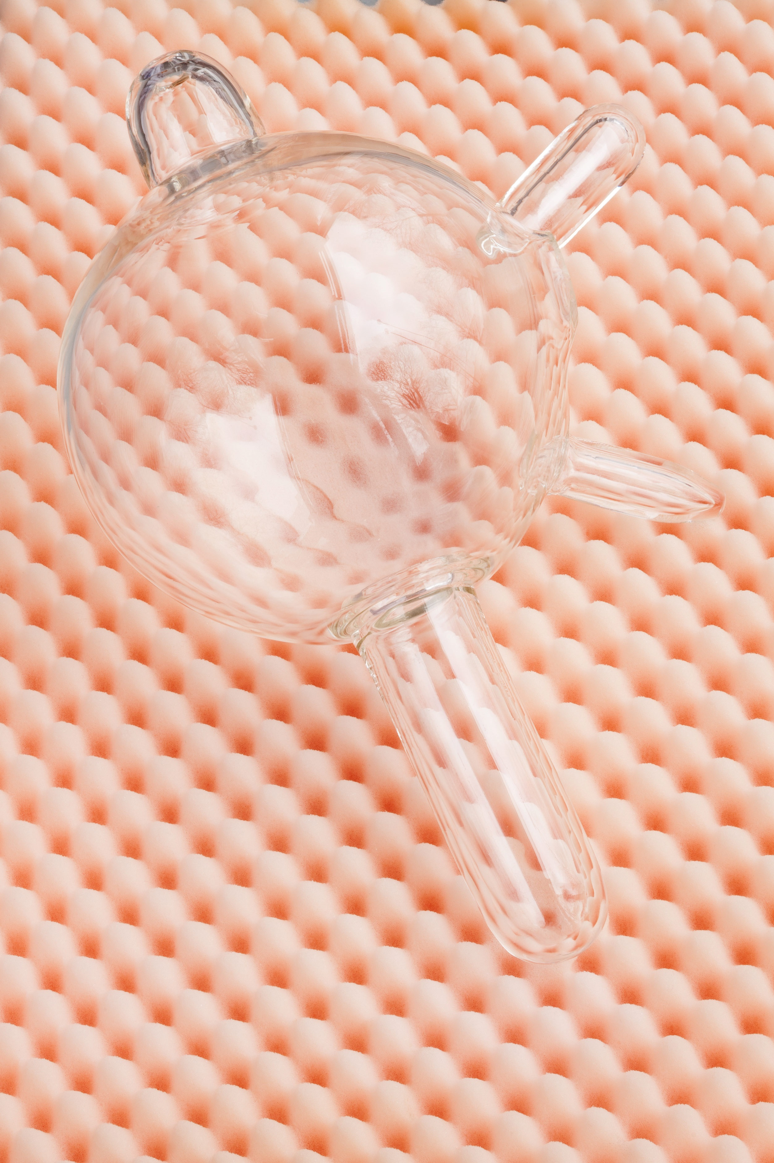 Dominique Hurth, soundless voices, bitten tongues, haptic hands, Blown glass, ceramics, glass, acrylic glass, acoustic foam, iron, 2019, exhibition view To want the world in a glass hat. at Neun Kelche, Copyright Dorothea Dittrich, VG Bildkunst 2024.