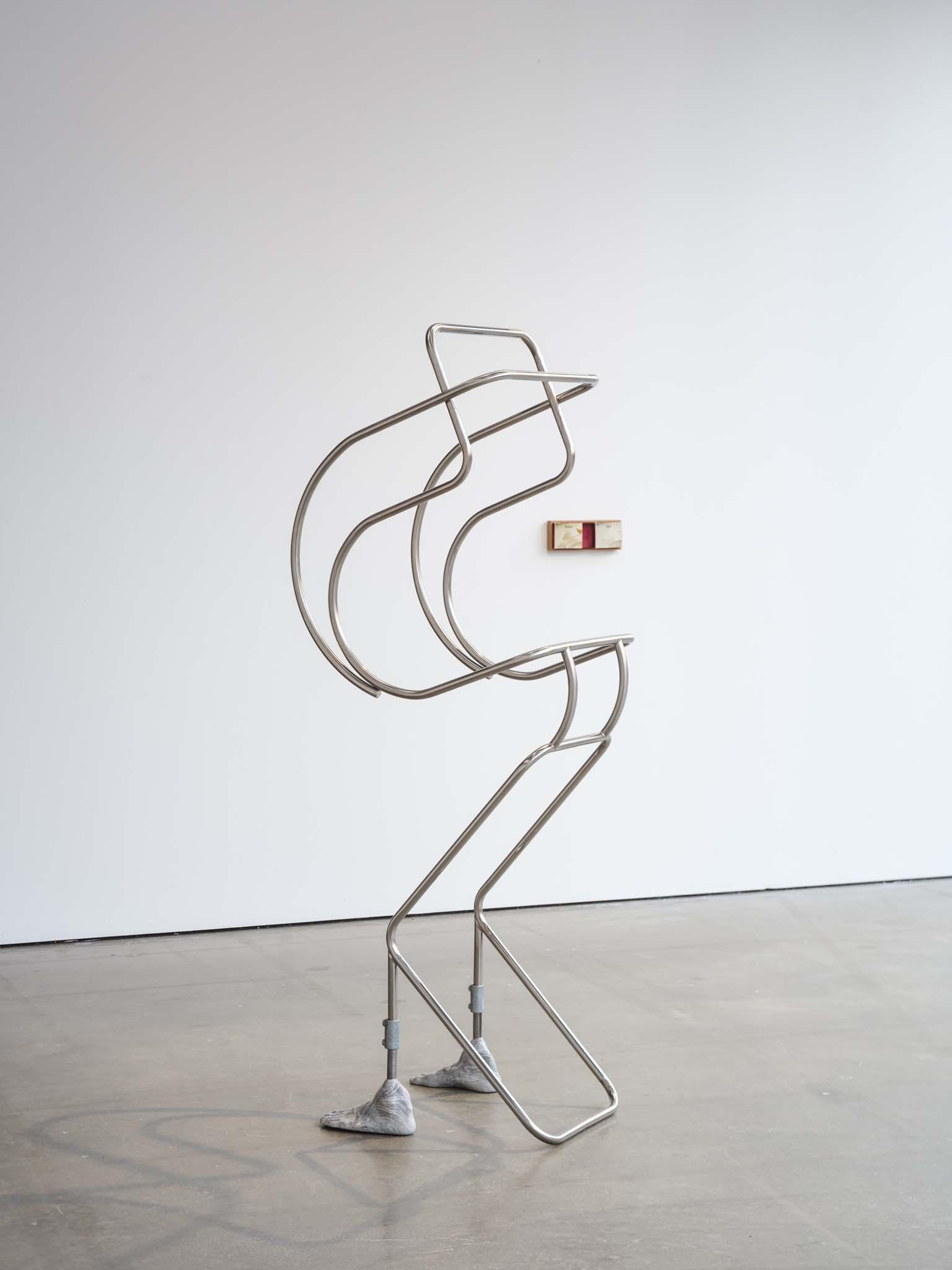 Natural Born Sitter, 2024 210x60x55 cm, Stainless steel, scaffolds, jesmonite Courtesy the artist and Galerie Nordenhake Berlin / Stockholm / Mexico City.