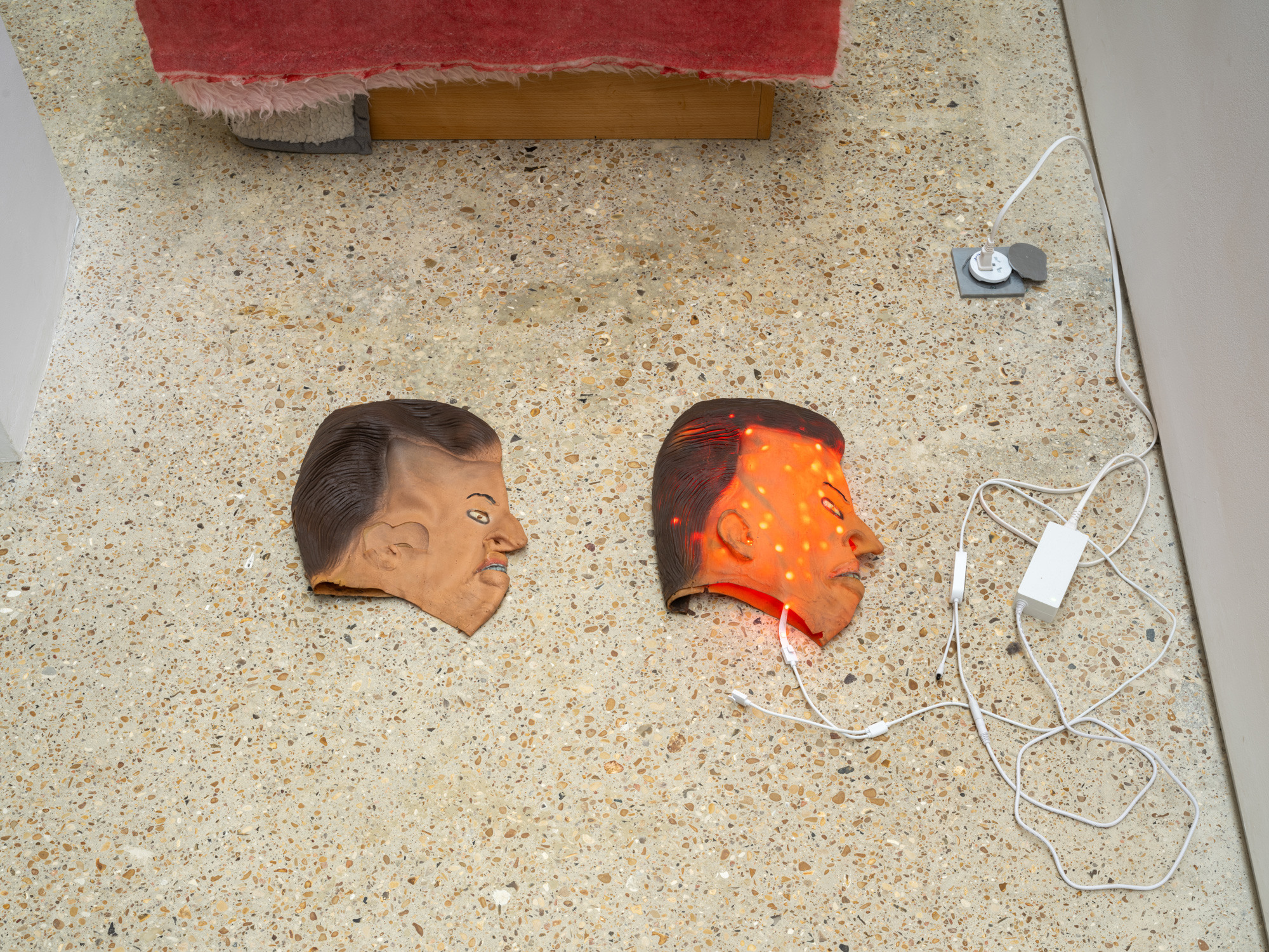 Michael E. Smith, Untitled, 2025, Masks, led lights, 86 × 37 cm. Courtesy of the artist and Crèvecœur, Paris. Photo: Martin Argyroglo