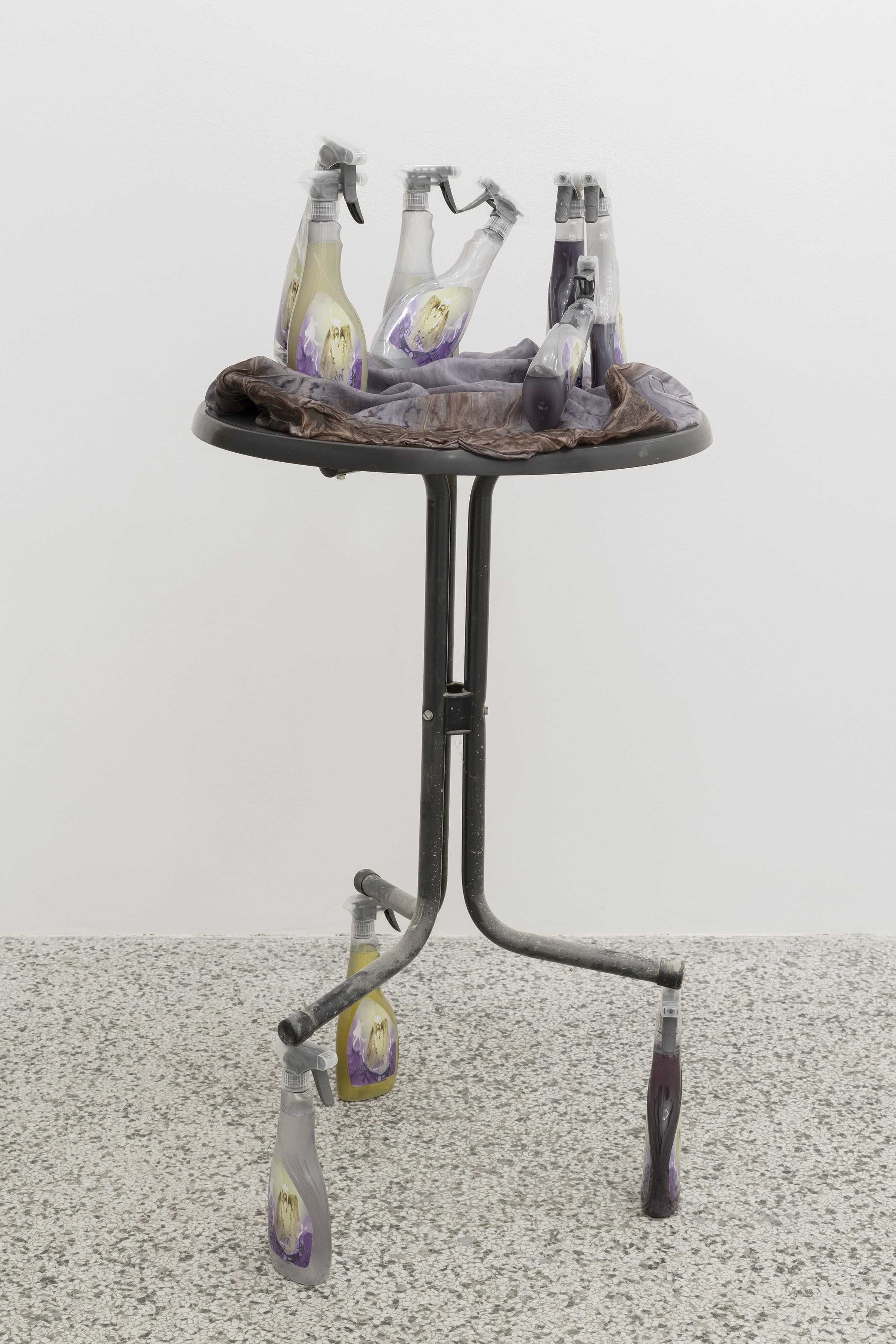 Marielena Stark, Verdant allies, 2025, Table, stickers, spray bottles, green tea, pastis, cochineal, rust, silk, 135 Ă 62 Ă 62 cm