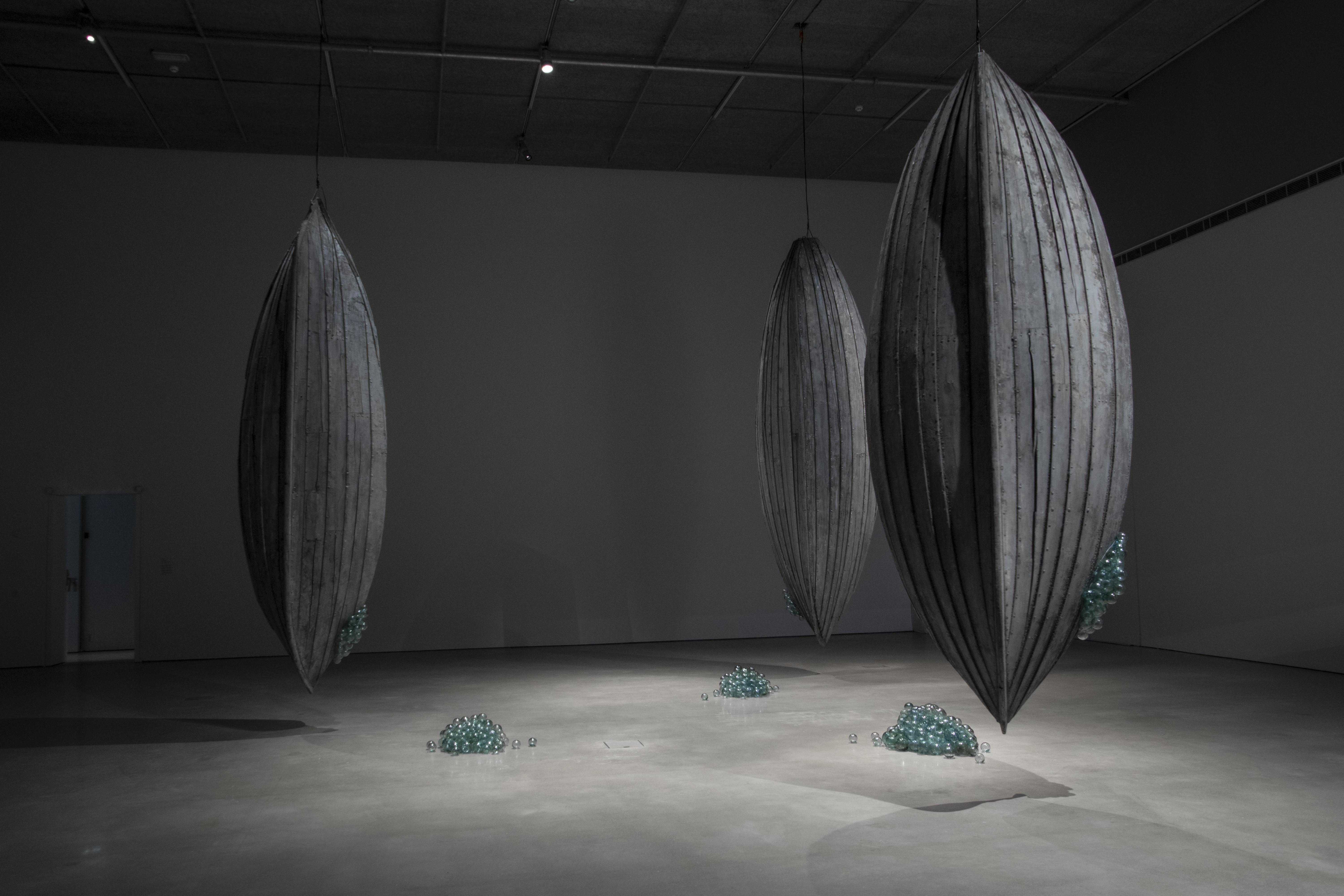 Anastasia Savinova, Dialects of The Deep, 2023, Old wooden boats, old glass fishing net floats, transducers, sound (in collaboration with sound artist John Andrew Wilhite and marine biologist Rebekah Oomen), exhibition view, Bonniers Konsthall, Stockholm.