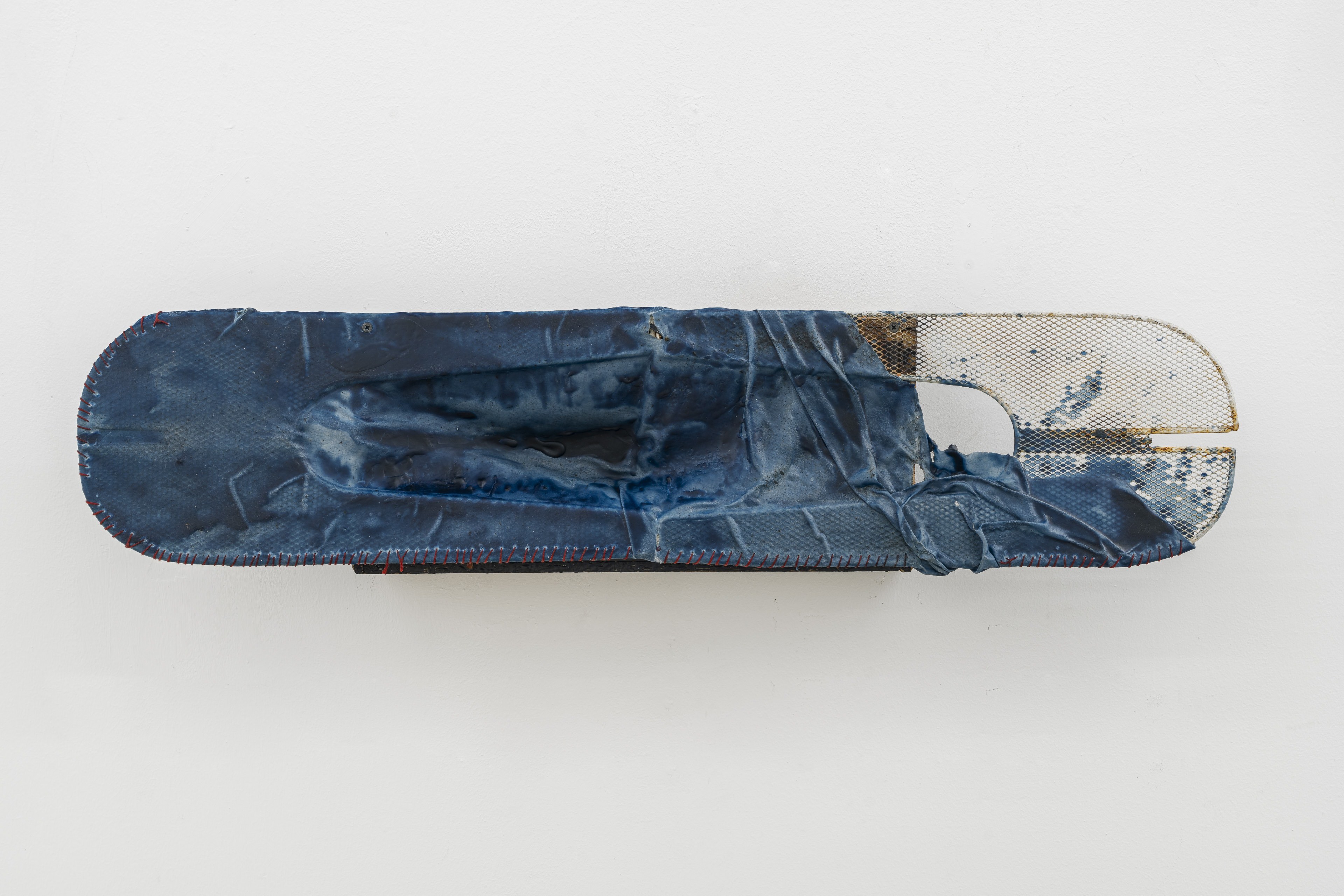 Bri Williams, Eye, 2025 Metal frame, beeswax, indigo dye, thread, wood, 92x21x14 cm, 36x8x5.5 in