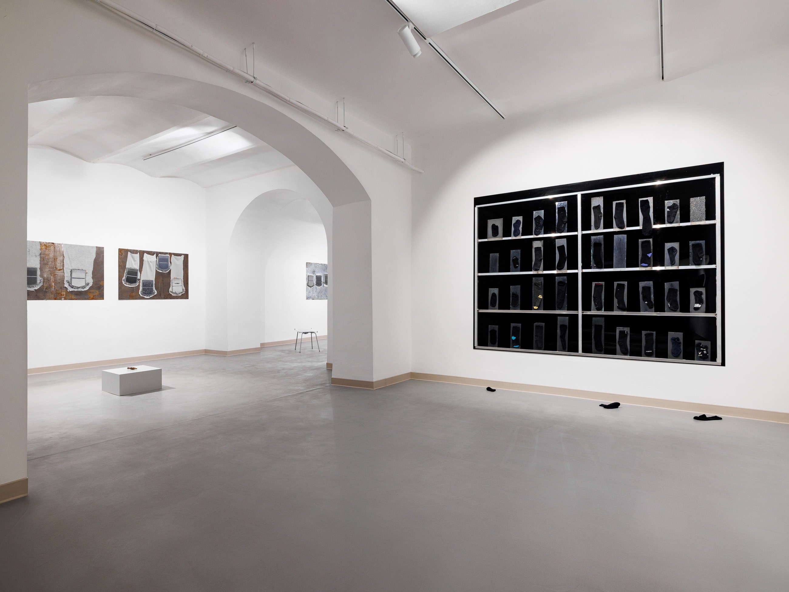 Black Holes, 2024, aluminum, plexiglass, socks, 200 x 270 cm, photo: Szymon SokoĆowski
