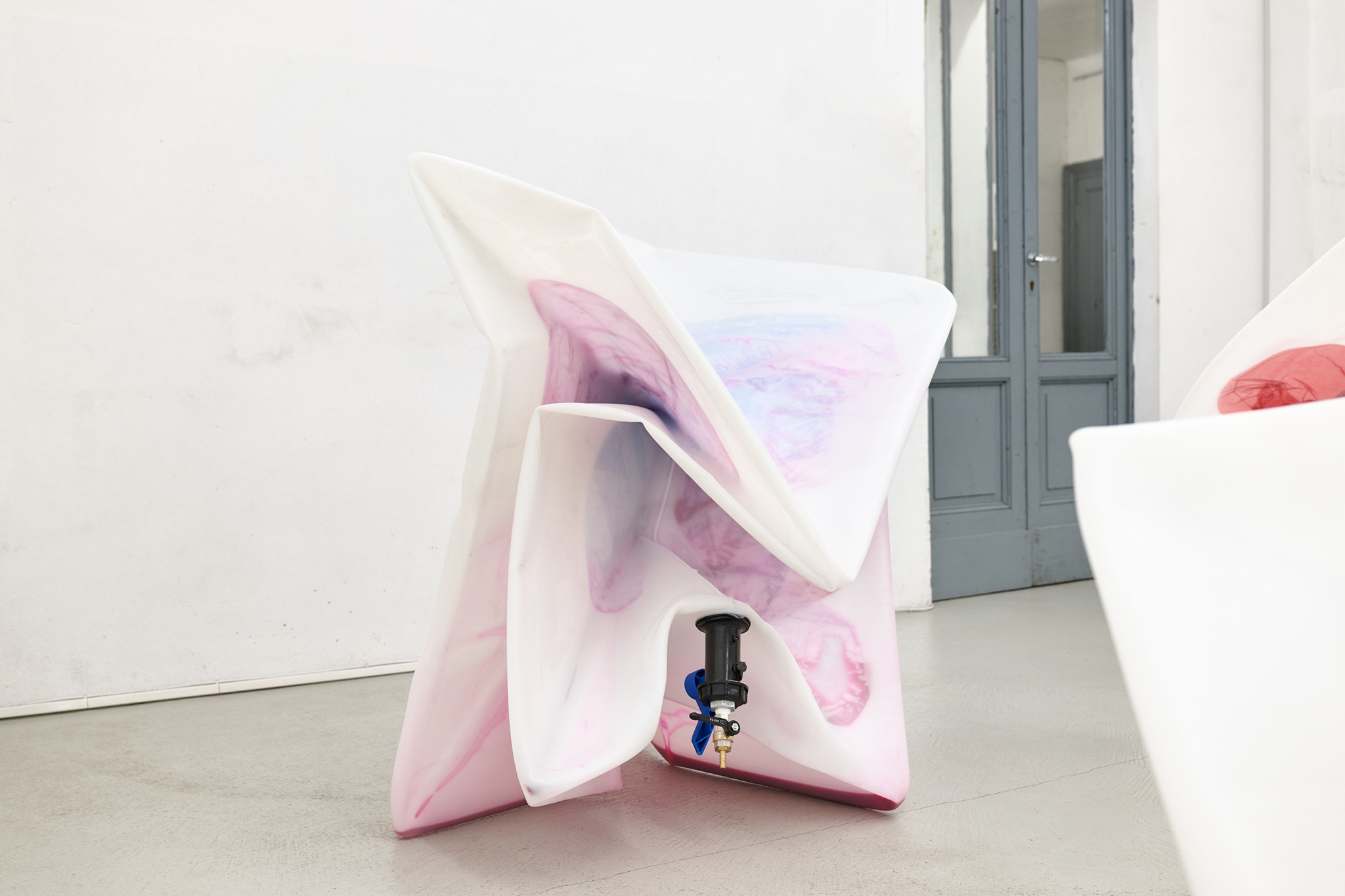 Sacha Kanah, Doodling on Calls, 2025, IBC, valve, inflatable sofa, raspberry juice, glass, vacuum, 91 x 110 x 112 cm