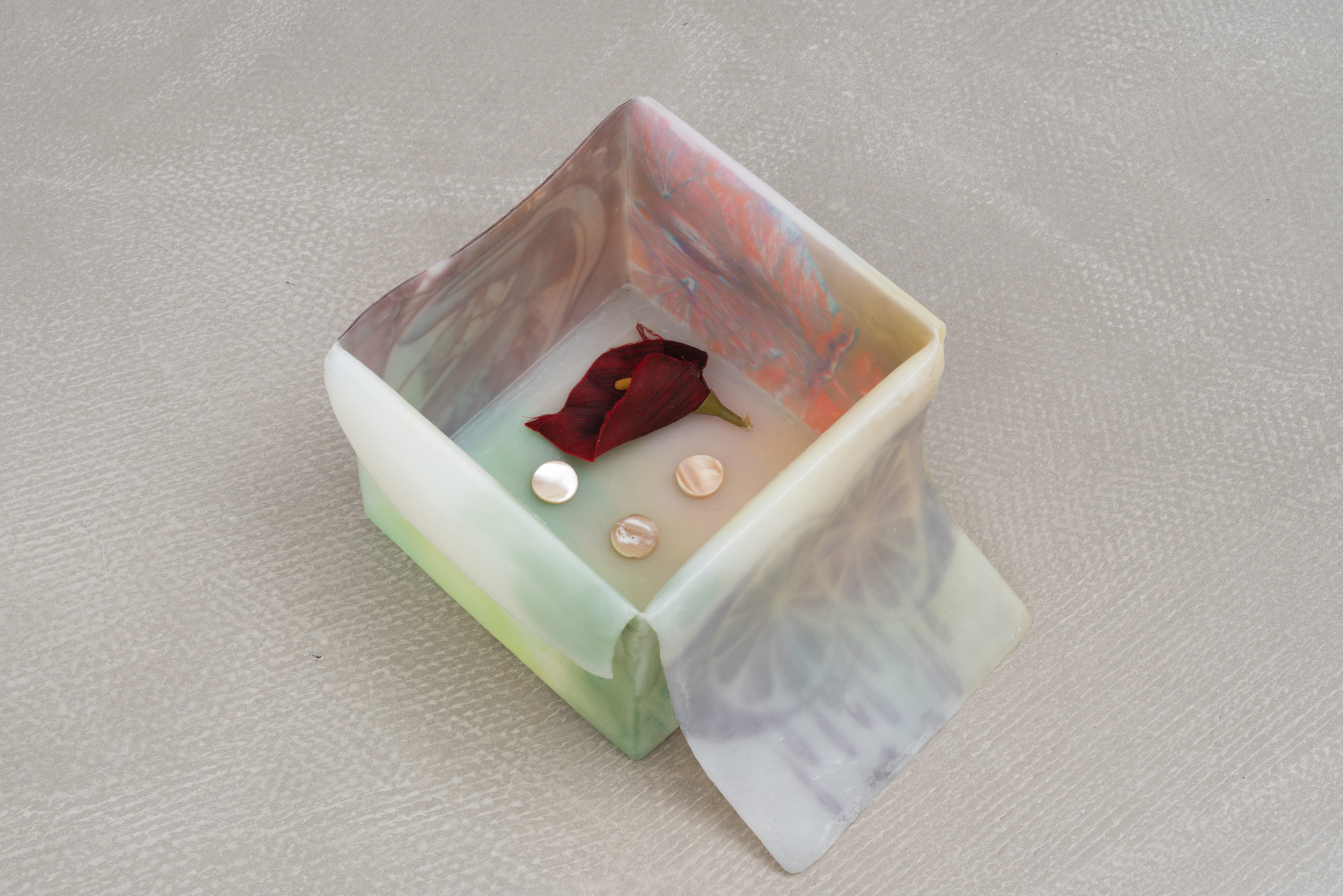 u, 2025 - inkjet print transfers on white glue, epoxy resin, anti-UV varnish, found objects, 19 x 31,5 x 26 cm