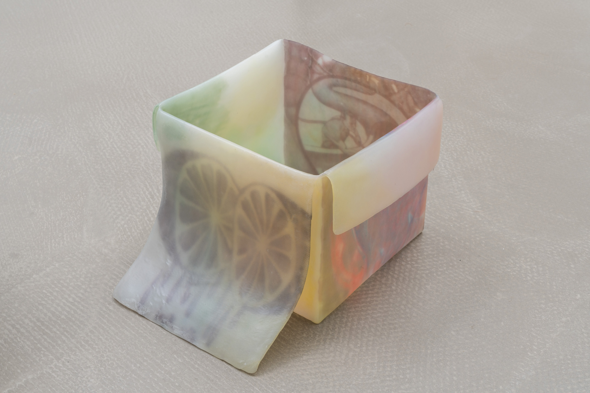 u, 2025 - inkjet print transfers on white glue, epoxy resin, anti-UV varnish, found objects, 19 x 31,5 x 26 cm