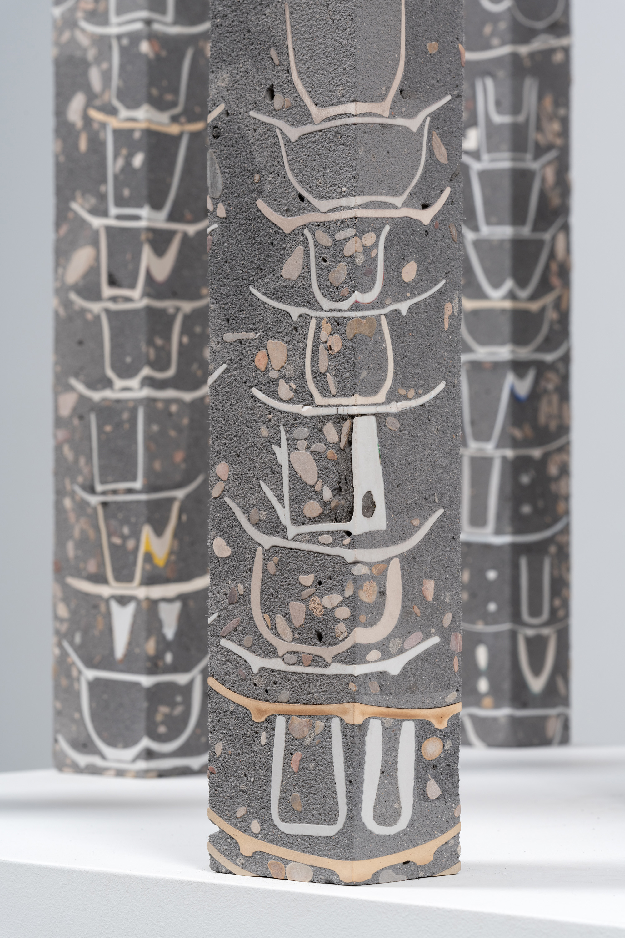 Javier Carro Temboury, Café Transversal V, 2025, Ceramic cups and dishes, organic leftovers, cast in concrete then cut. 76 x 10 x 8 cm each.