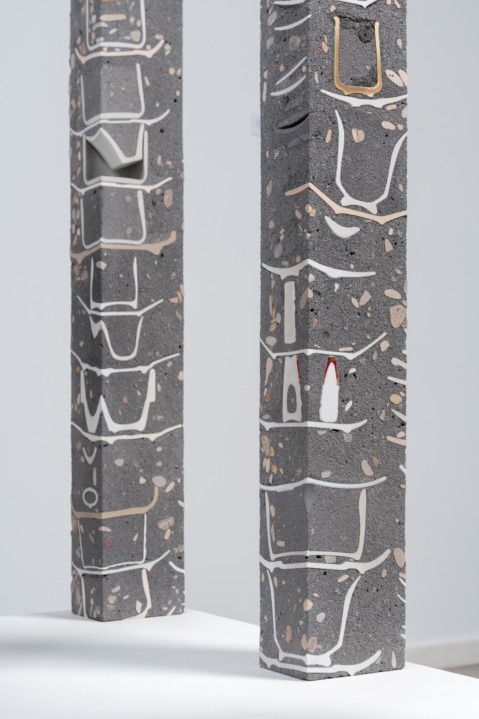 Javier Carro Temboury, Café Transversal V, 2025, Ceramic cups and dishes, organic leftovers, cast in concrete then cut. 76 x 10 x 8 cm each.