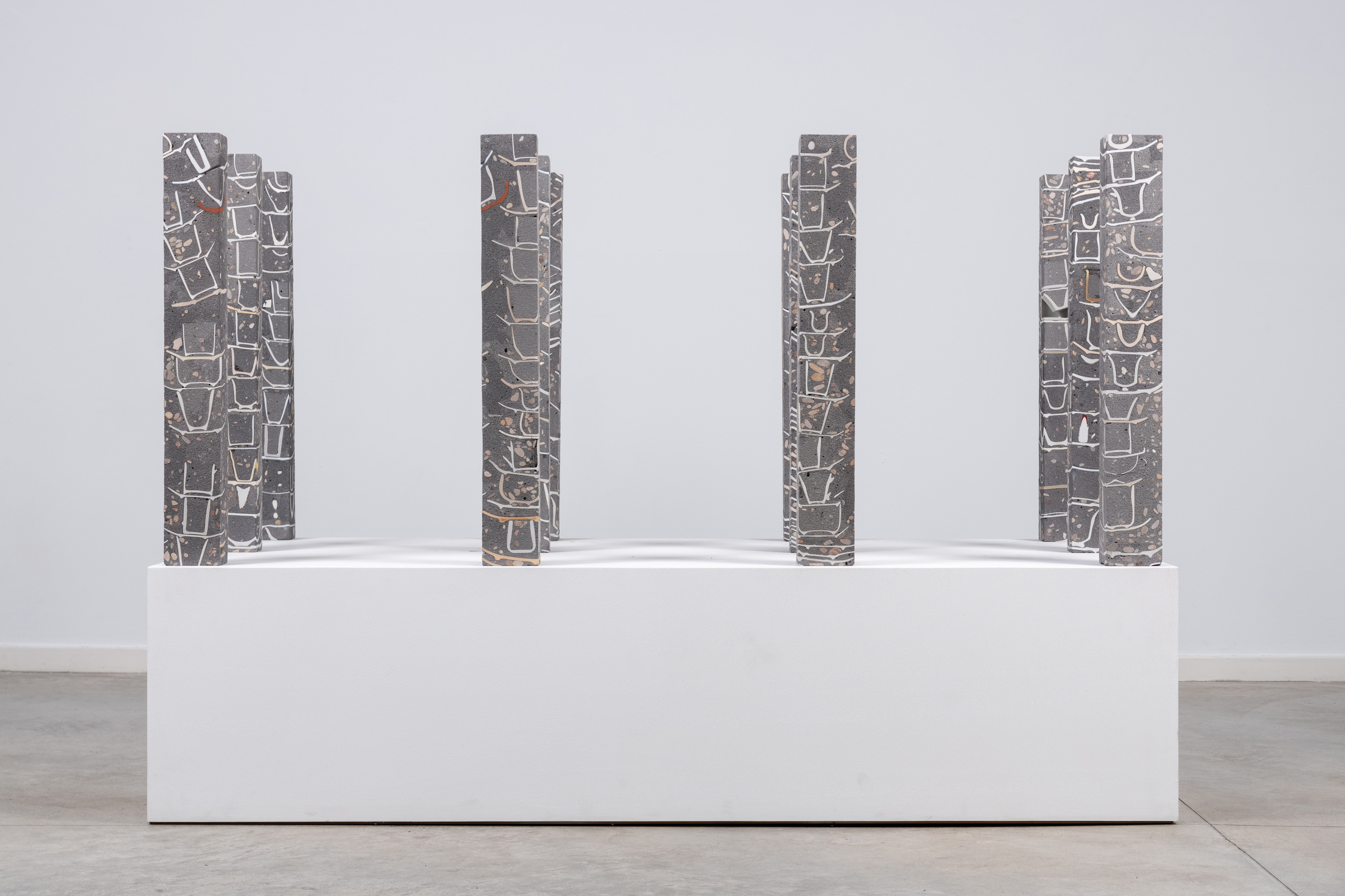 Javier Carro Temboury, Café Transversal V, 2025, Ceramic cups and dishes, organic leftovers, cast in concrete then cut. 76 x 10 x 8 cm each.