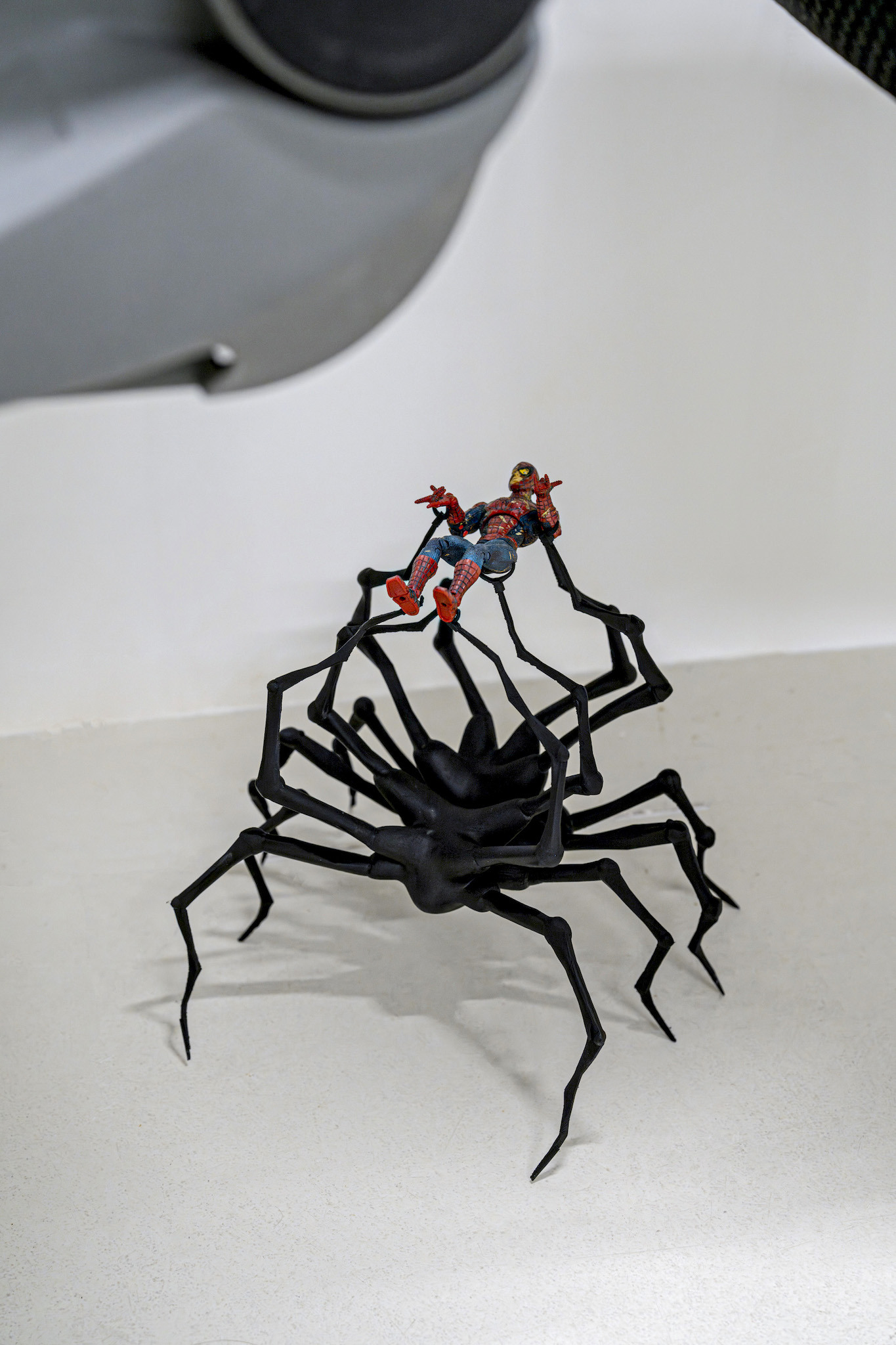 hope we’re not there yet, 2024, bus seats, oil painting on canvas, 3d print spider (pla), 22-year-old spiderman toy