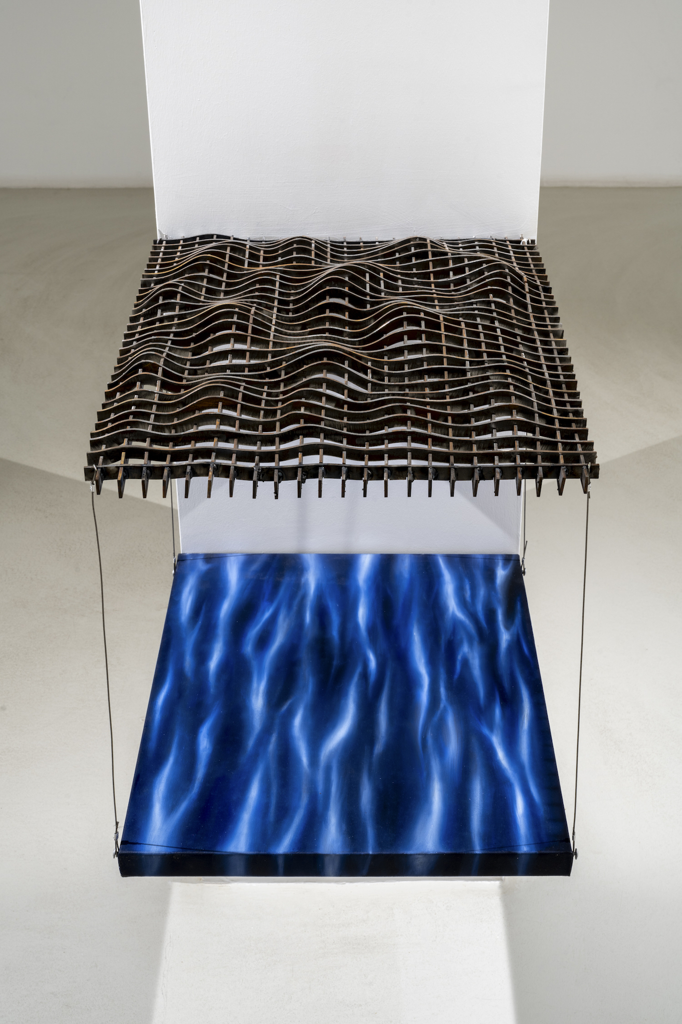 sometimes I look at the water and think, 2024, laser-cut iron, oil paint on canvas, steel cable