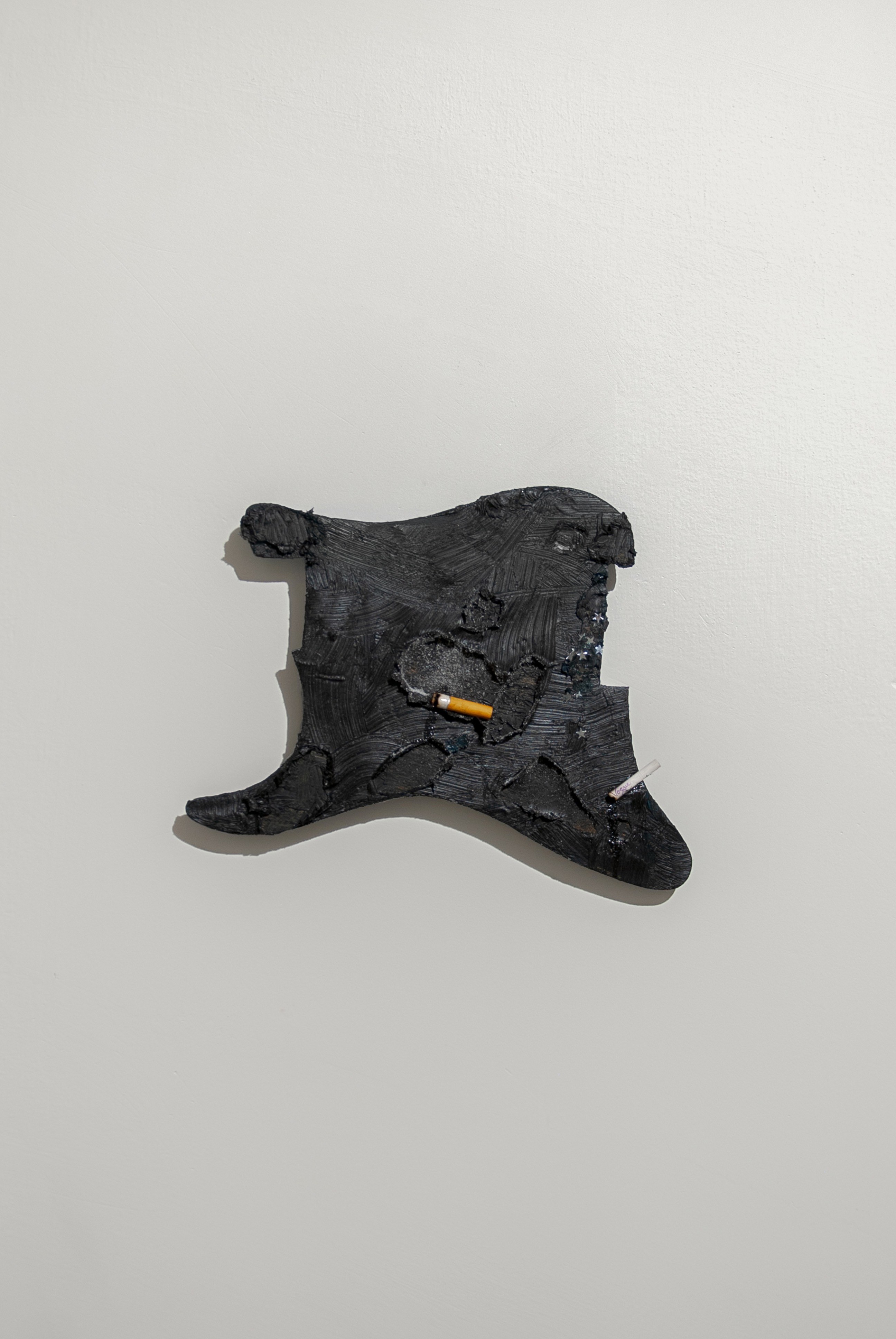 Joakim Hyldebrandt, Untitled idol 1, 2025, Wood, oil paint, cigaret, pill, sugar, star, coin, glitter, 28 x 22 cm