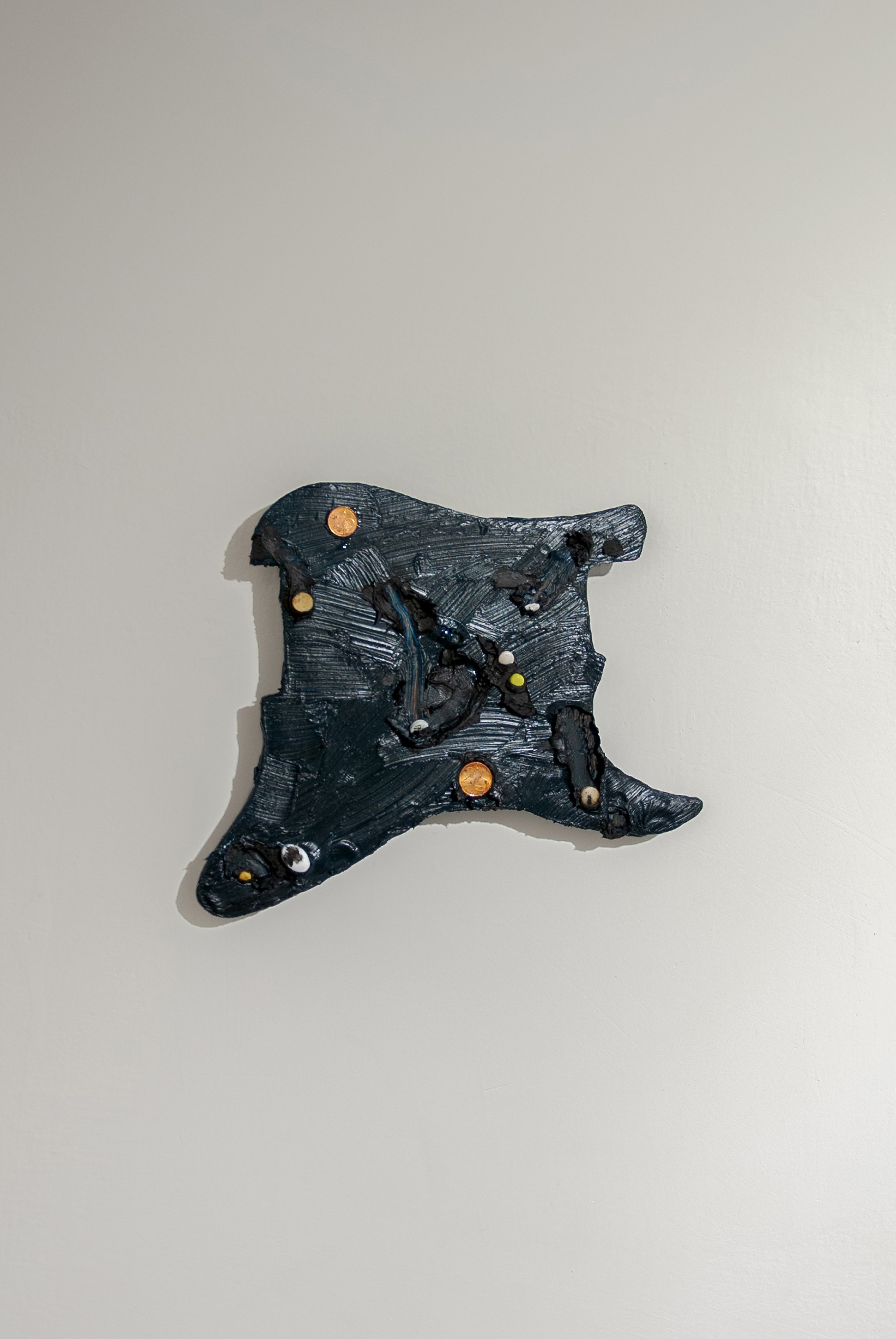 Joakim Hyldebrandt, Untitled idol 3, 2025, Wood, oil paint, cigaret, pill, sugar, star, coin, glitter, 28 x 22 cm