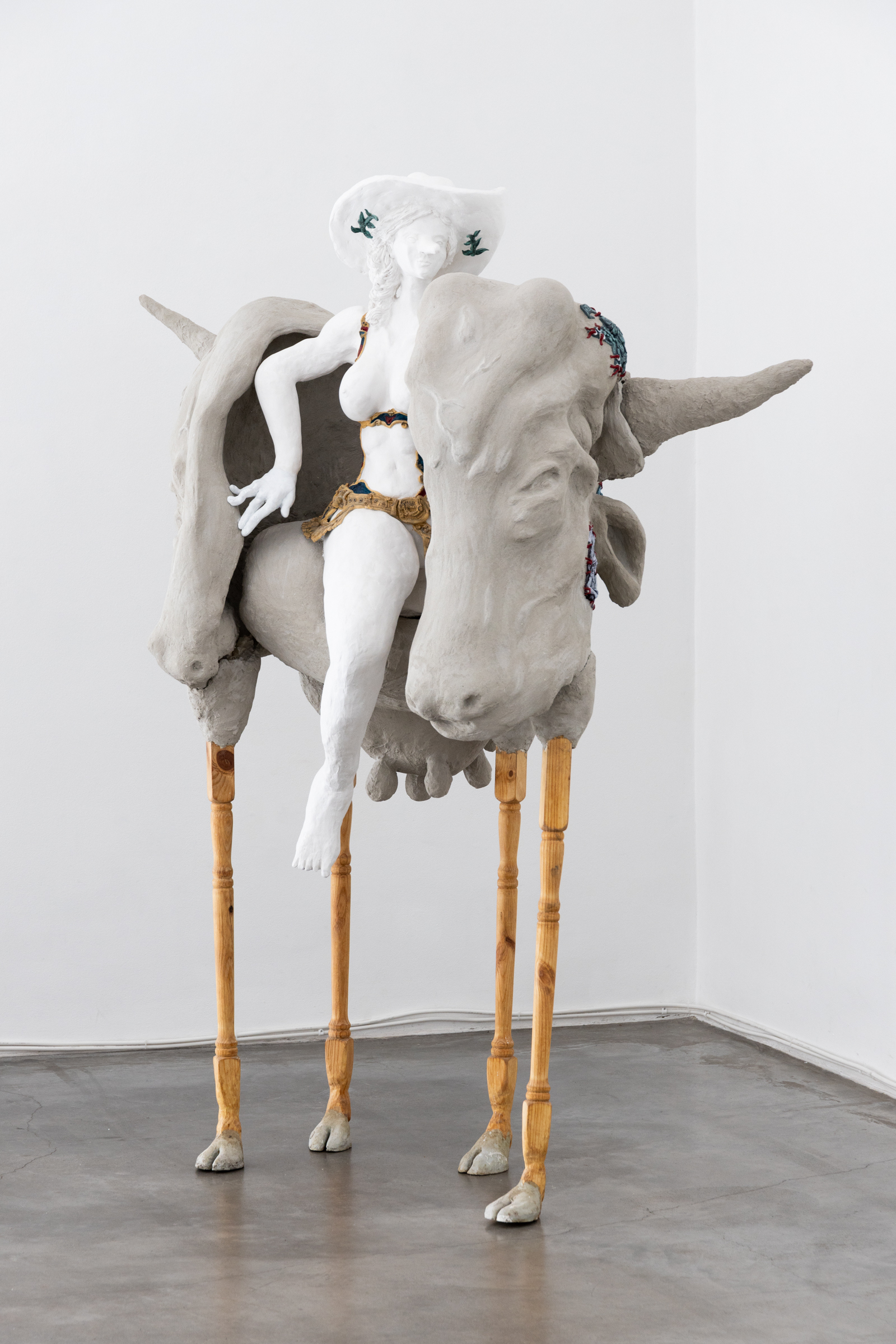 Pasiphaë, Queen of the Rodeo. Plaster, wood, approximately 2000 Prisma receipts, acrylic, tanned cow tail. 1.4 x .85 x 1.7 m 2025. Photo: Jane Treima