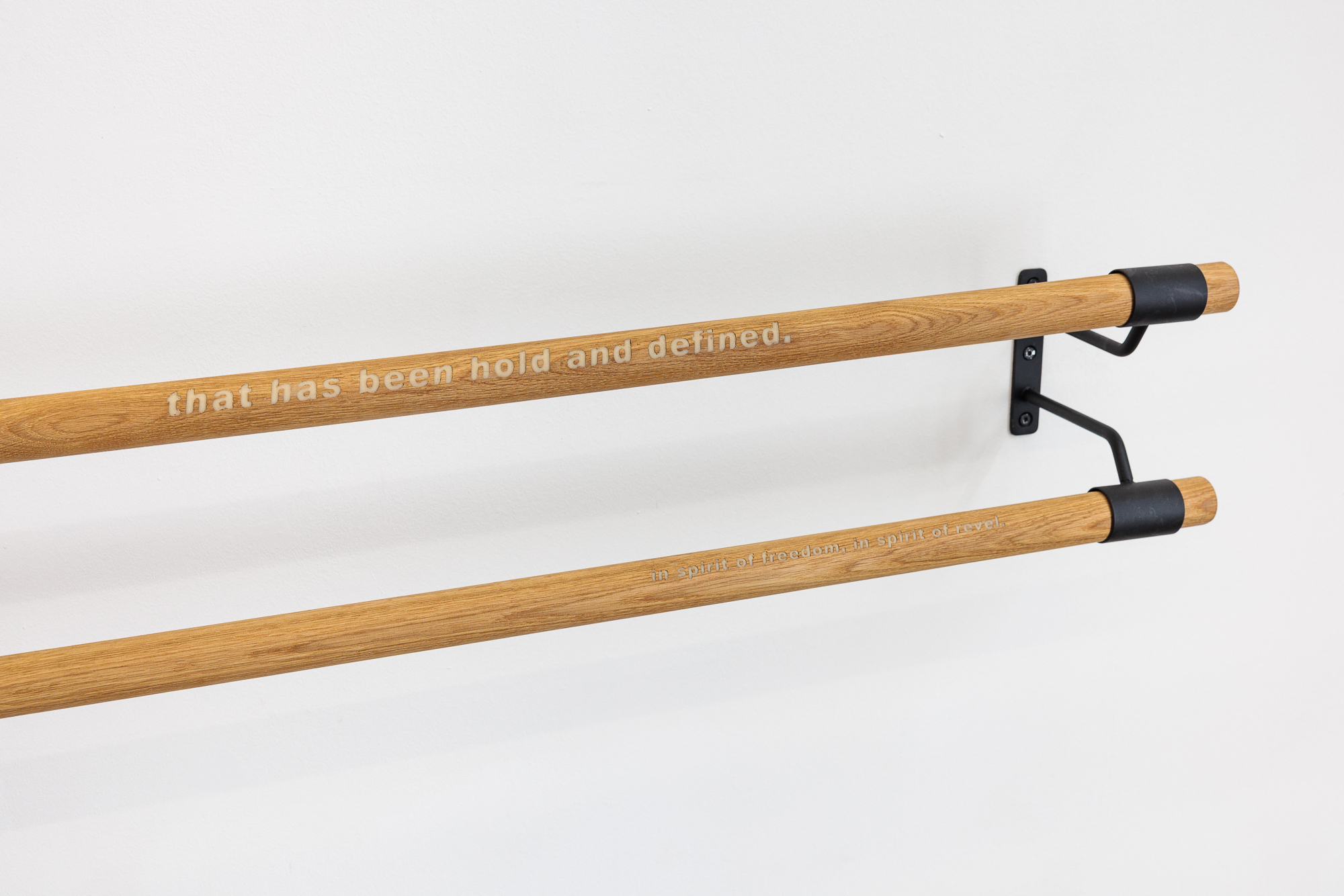 Anna K.E., There is a posture, that has been hold and defined, / in spirit of freedom, in spirit of revel., 2024, wood, metal, marzipan paste, w = 220 cm