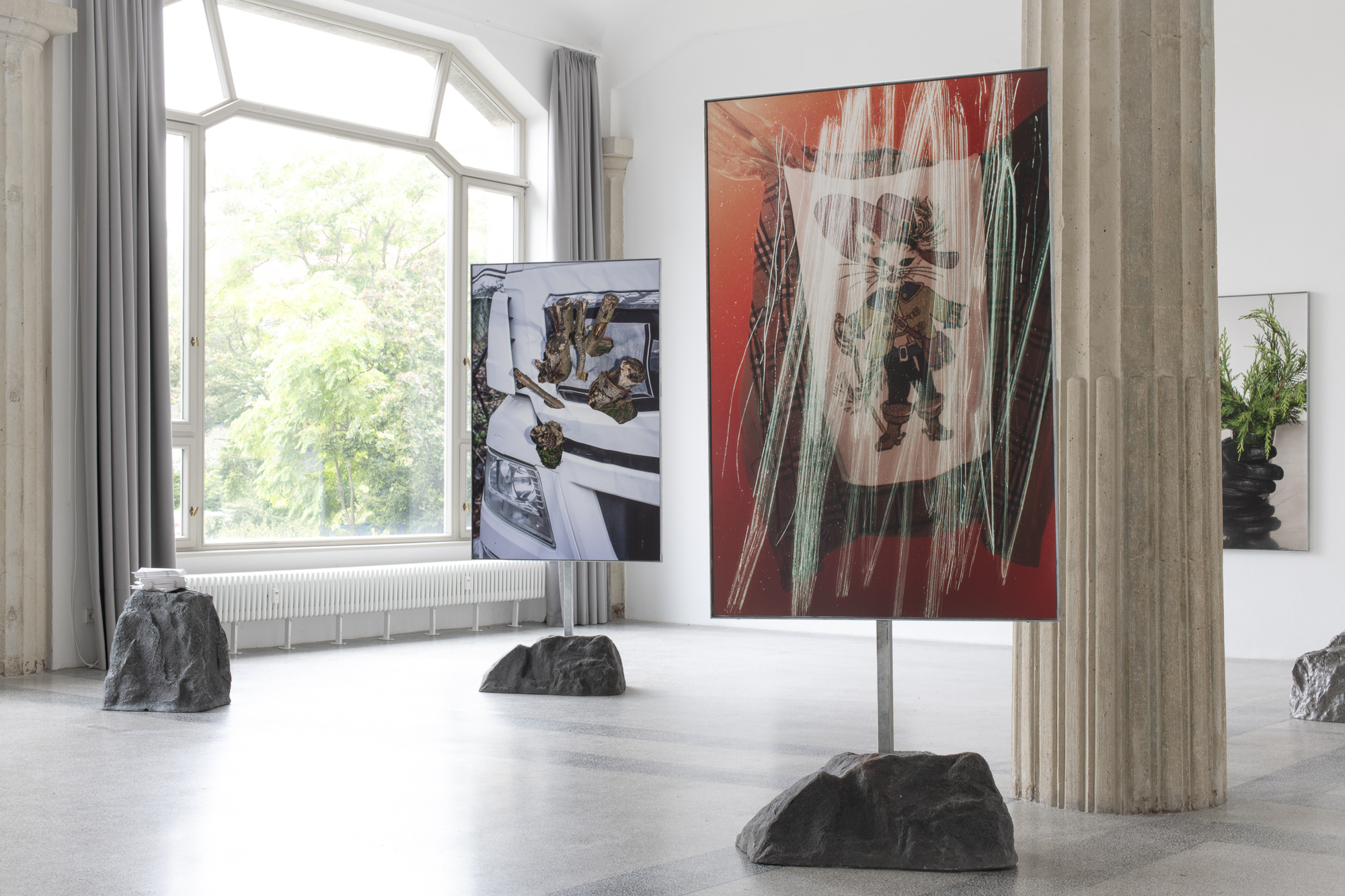 Väter, 2025, texts, artificial stone; Vergiß es, Magical Rage, 2024 & Der Kater wird die Zaubermaus fressen, Magical Rage, 2024, 160 x 106 cm, fine art inkjet prints, hot-dip galvanized steel frames, steel rods, artificial stones