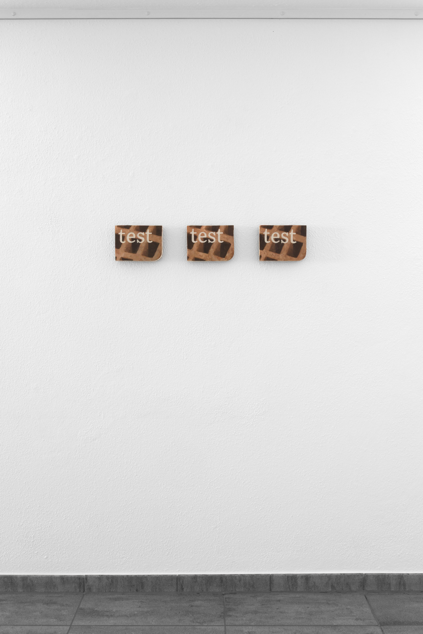 Christopher Friess, test test test, 2025, Fresco, sgraffito on mineral board, 3 parts each 15 × 20 cm