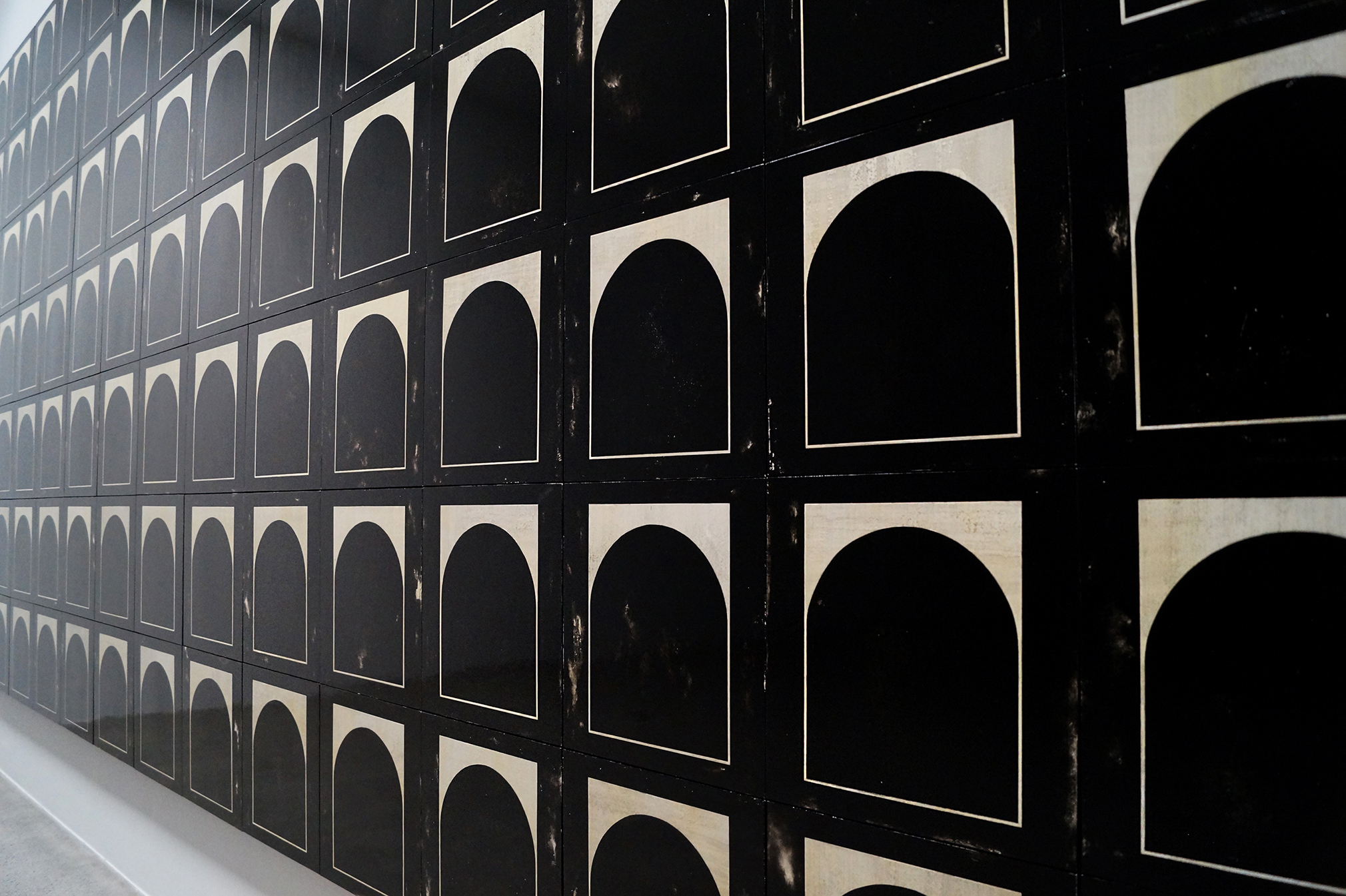Sofiia Yesakova, Blind Spot 2.1.-2.100., each 40 × 40 × 5, total 280 × 560 × 5 cm, Acrylic, gesso, gelatine, varnish on wooden board, 2025. Close-up