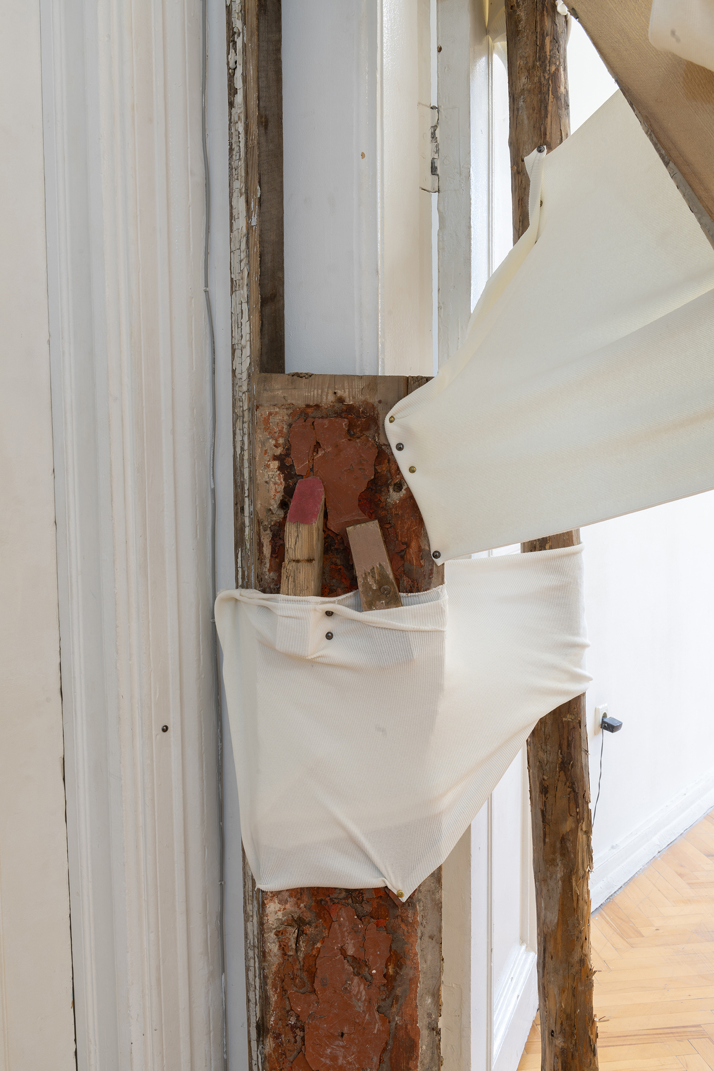Detail of Ana Gzirishvili, Untitled, 2025, Secondhand Wood Planks, Wood Fragments, Plaster, Sequin Beads, Upholstery Nails, Fabric, 335x220 cm