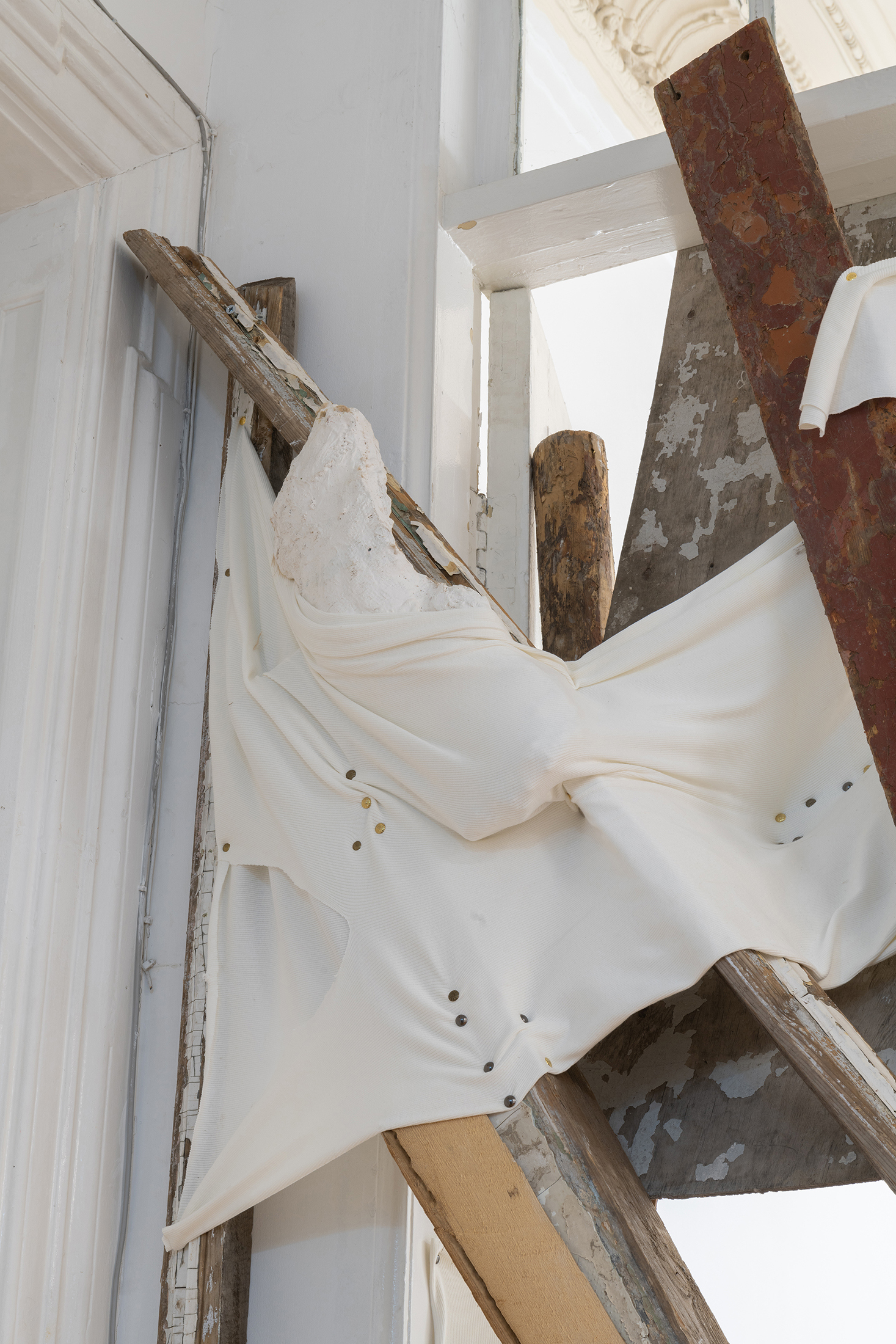 Detail of Ana Gzirishvili, Untitled, 2025, Secondhand Wood Planks, Wood Fragments, Plaster, Sequin Beads, Upholstery Nails, Fabric, 335x220 cm