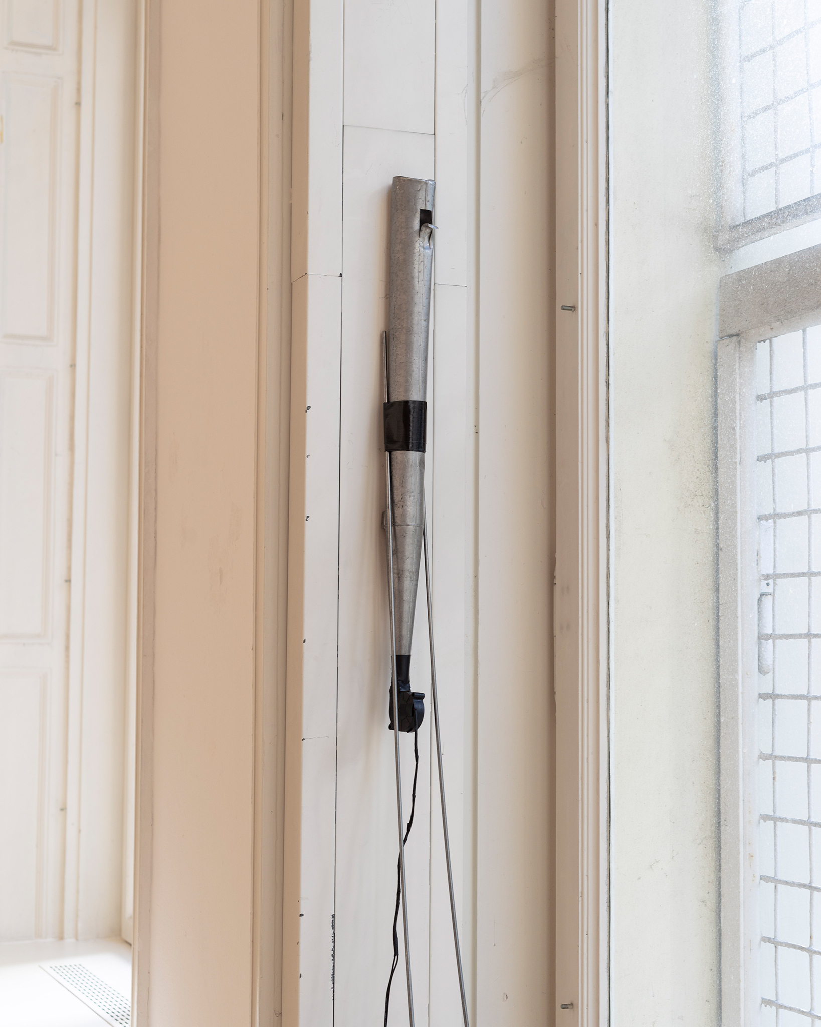 Miriam Steinmacher „Partial Limbo“ , 2021. Organ pipe, radial blower, tape, steel rods. 340 × variable length