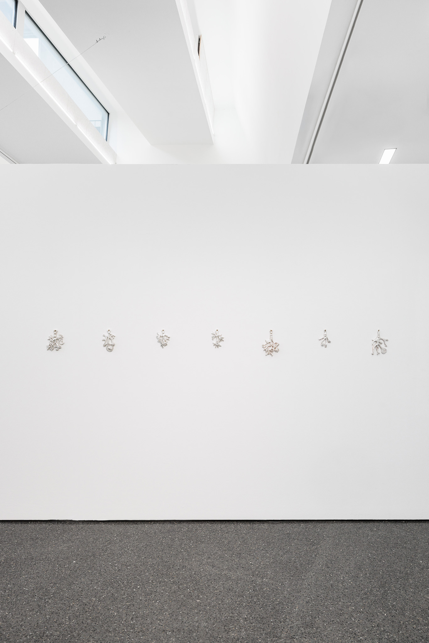 Anaïs Horn, Under Lunar Influence 1–7, 2024–2025.  Polyester clay, silver leaf, lacquer, approx. 20 × 12 cm each.