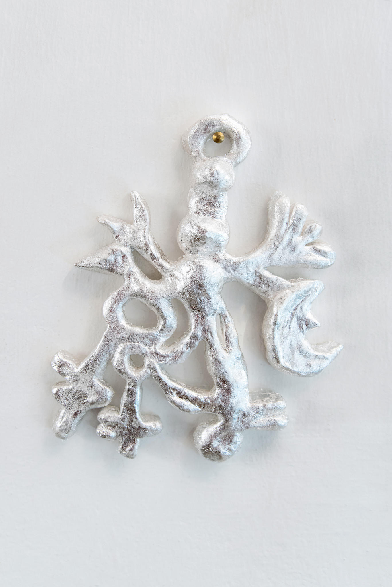 Anaïs Horn, Under Lunar Influence 1–7, 2024–2025.  Polyester clay, silver leaf, lacquer, approx. 20 × 12 cm each.