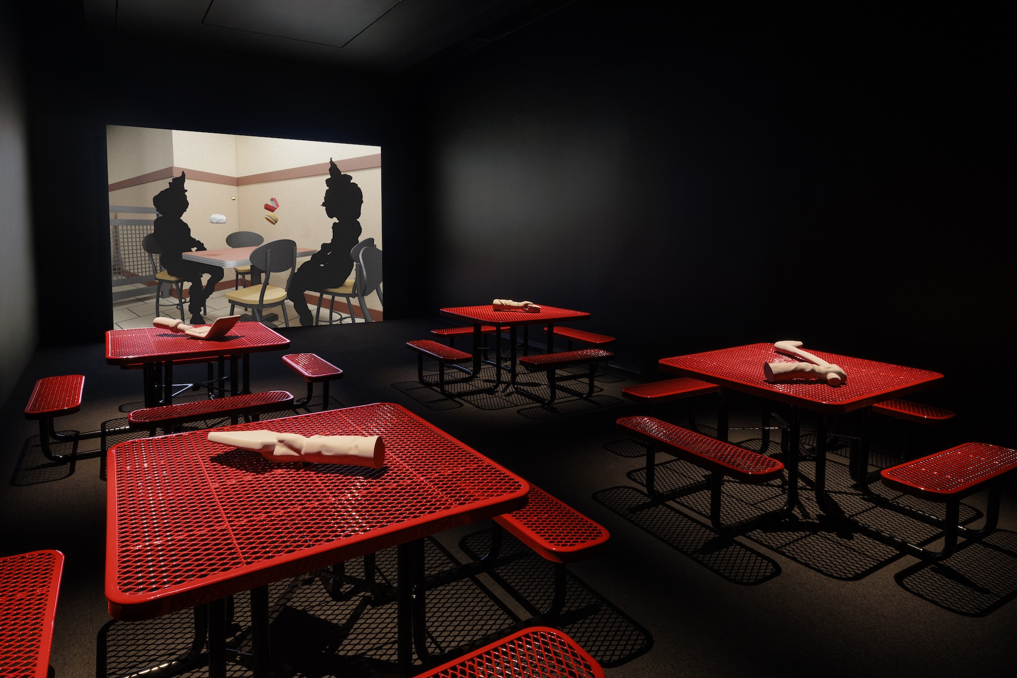 Me persigue tu sombra, 2025. Commercial door and tables, light box, PLA 3D prints, and digital animation.