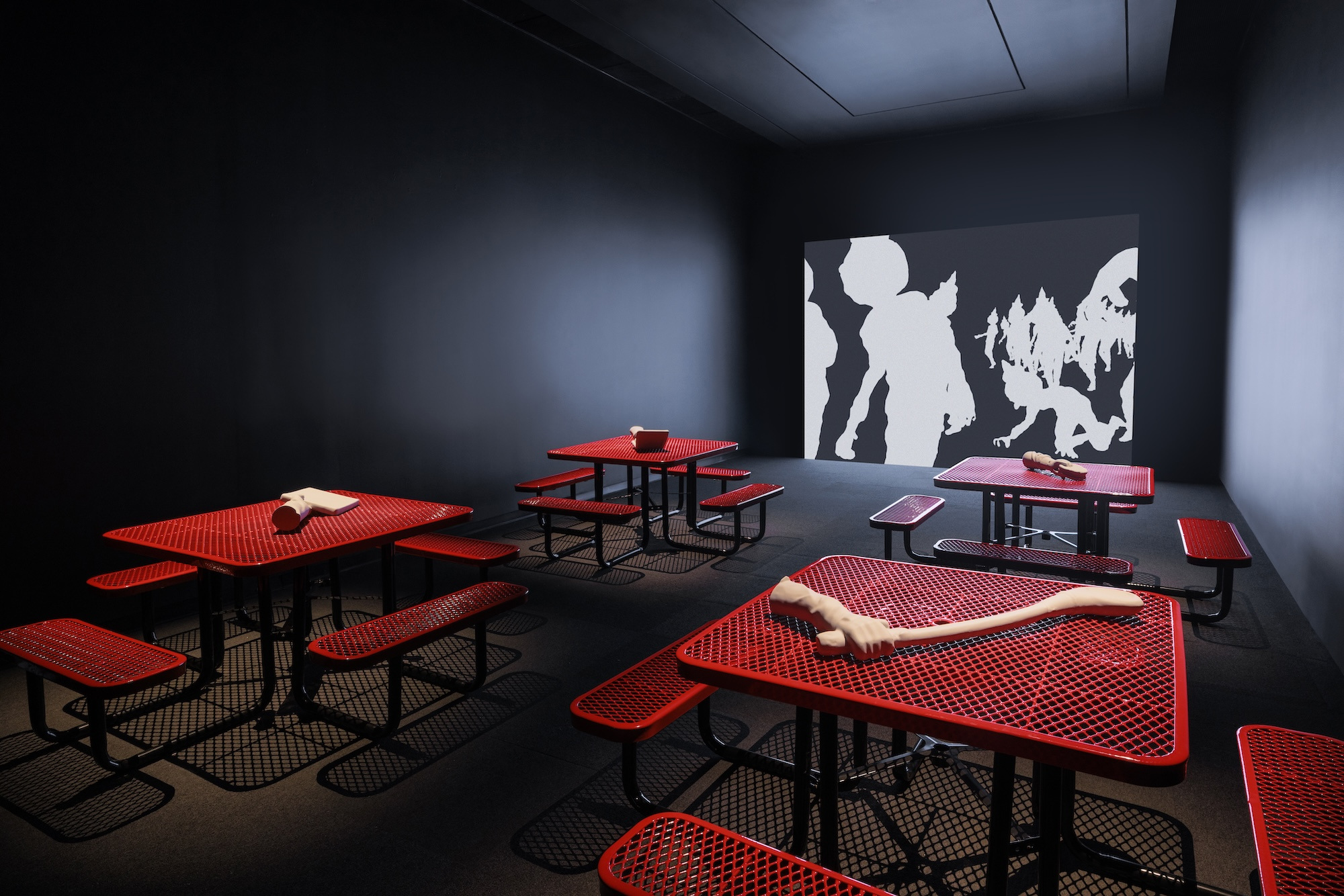 Me persigue tu sombra, 2025. Commercial door and tables, light box, PLA 3D prints, and digital animation.