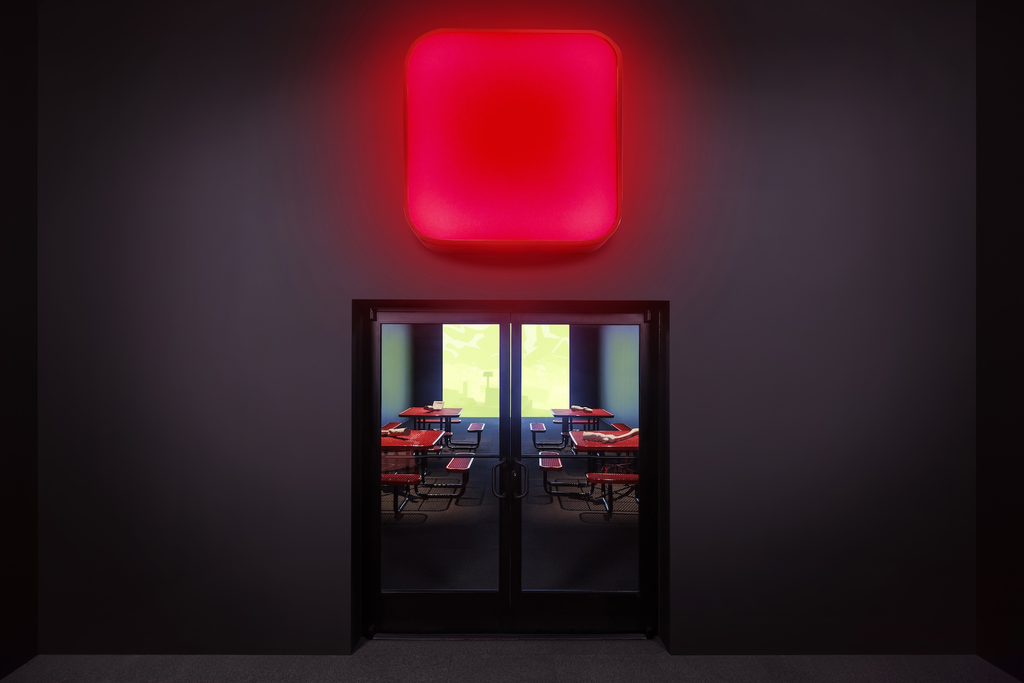 Me persigue tu sombra, 2025. Commercial door and tables, light box, PLA 3D prints, and digital animation.