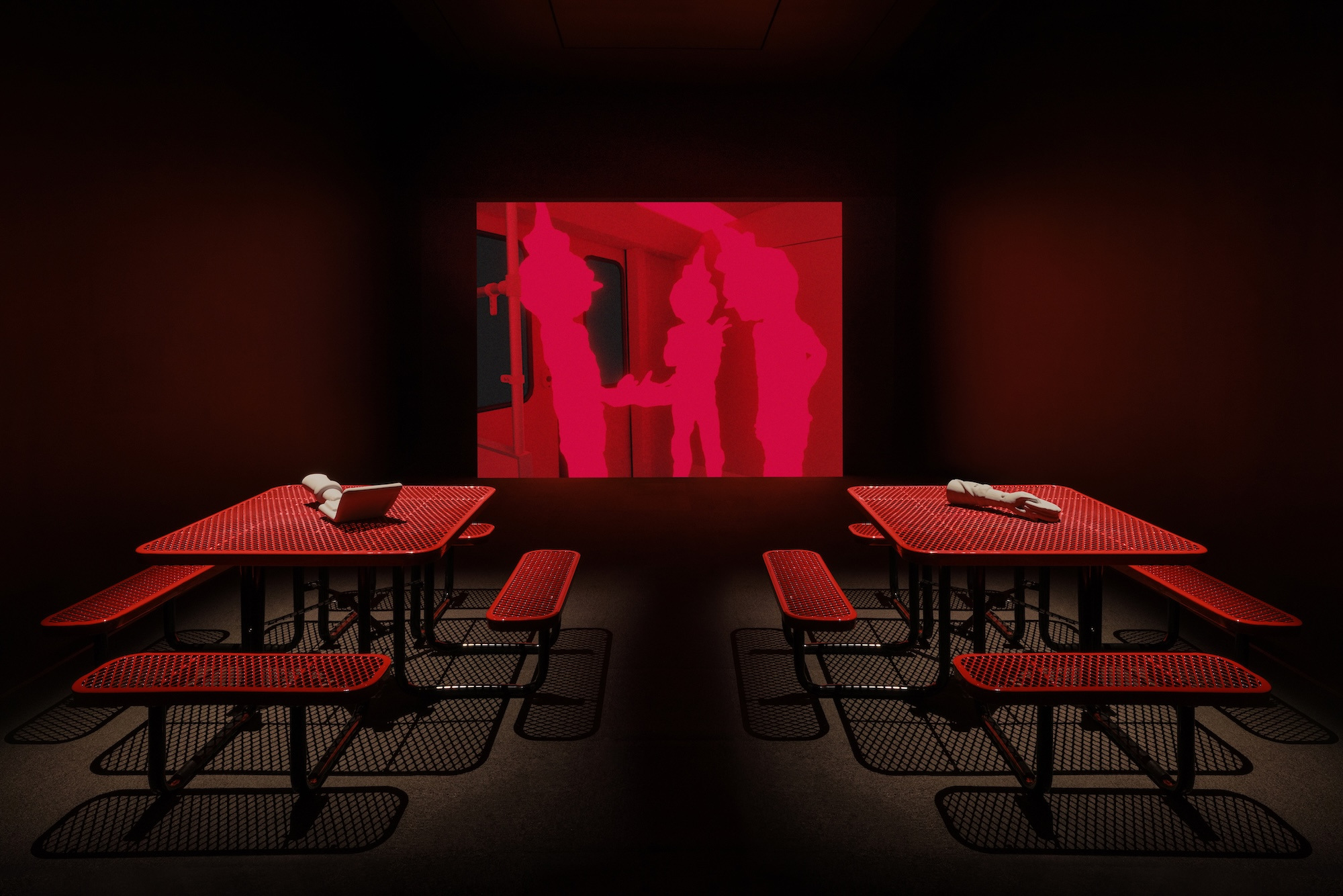 Me persigue tu sombra, 2025. Commercial door and tables, light box, PLA 3D prints, and digital animation.