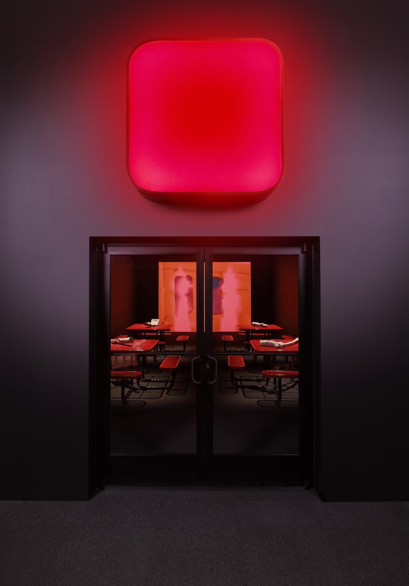 Me persigue tu sombra, 2025. Commercial door and tables, light box, PLA 3D prints, and digital animation. 