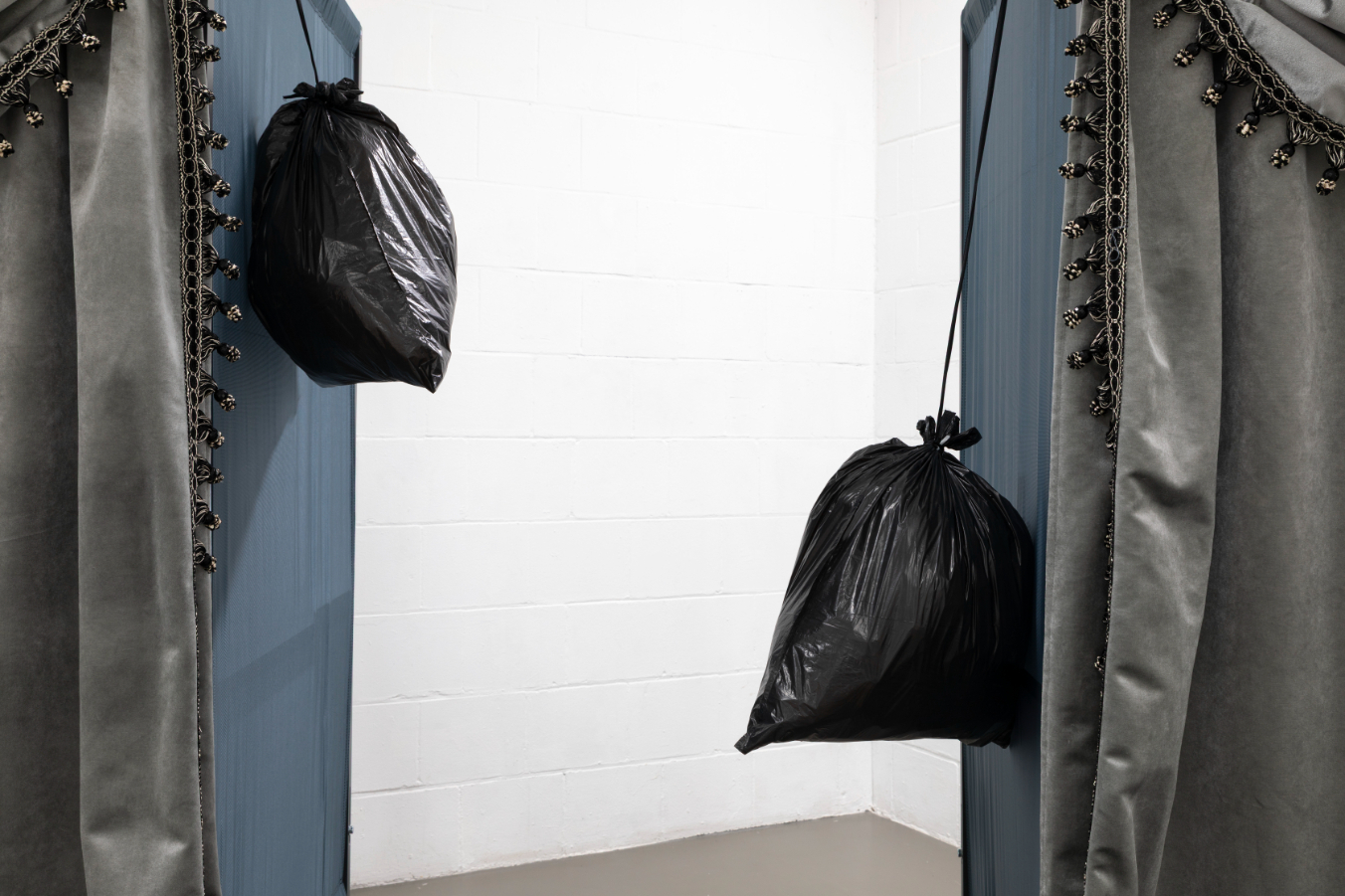 Yeşim Akdeniz, Repeated Temporary (detail), (2025). Standard voting cabin, curtain, trash bag, rope. 200x90x120cm each.